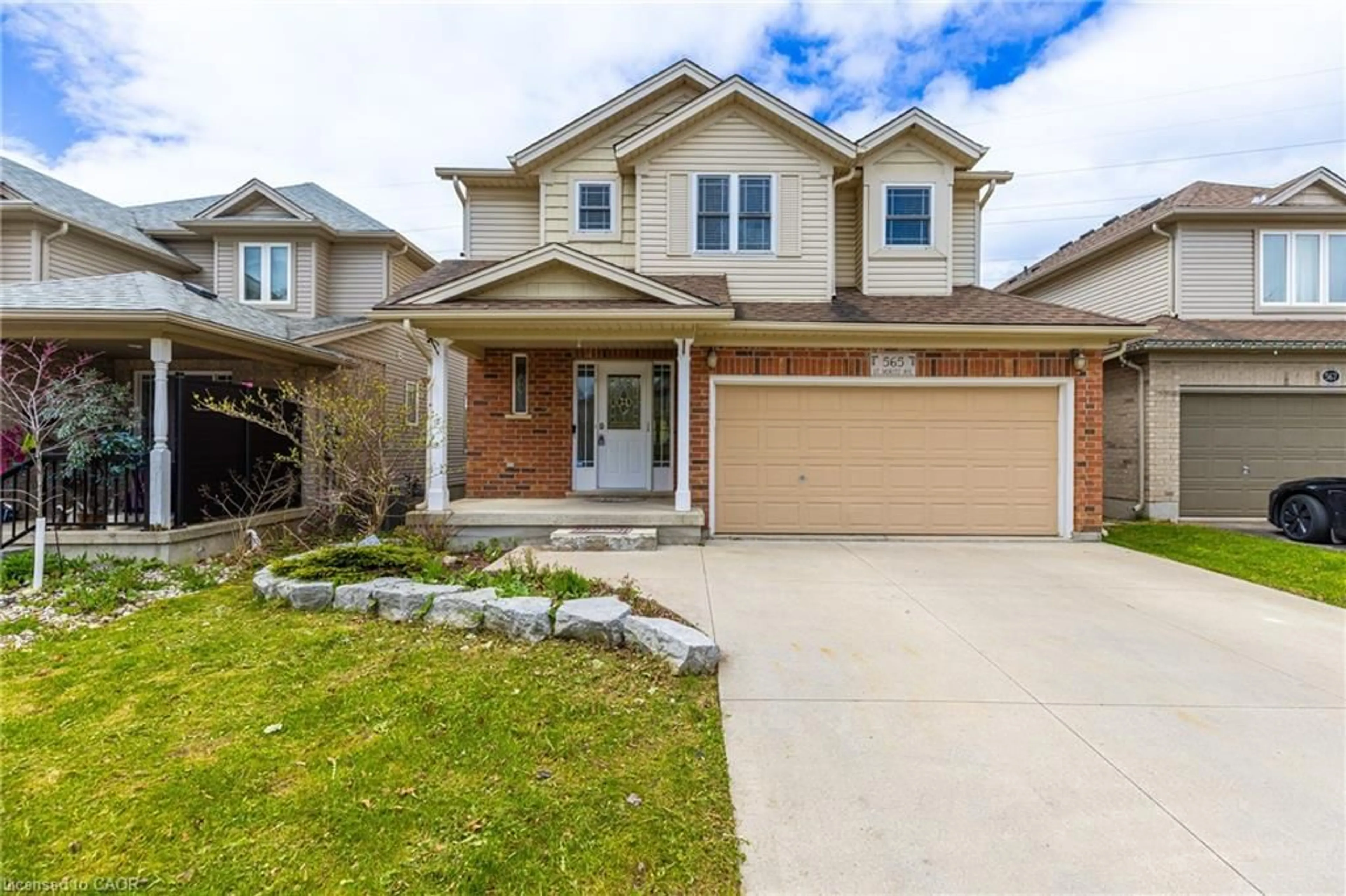 Home with brick exterior material, street for 565 St Moritz Ave, Waterloo Ontario N2T 2Z3