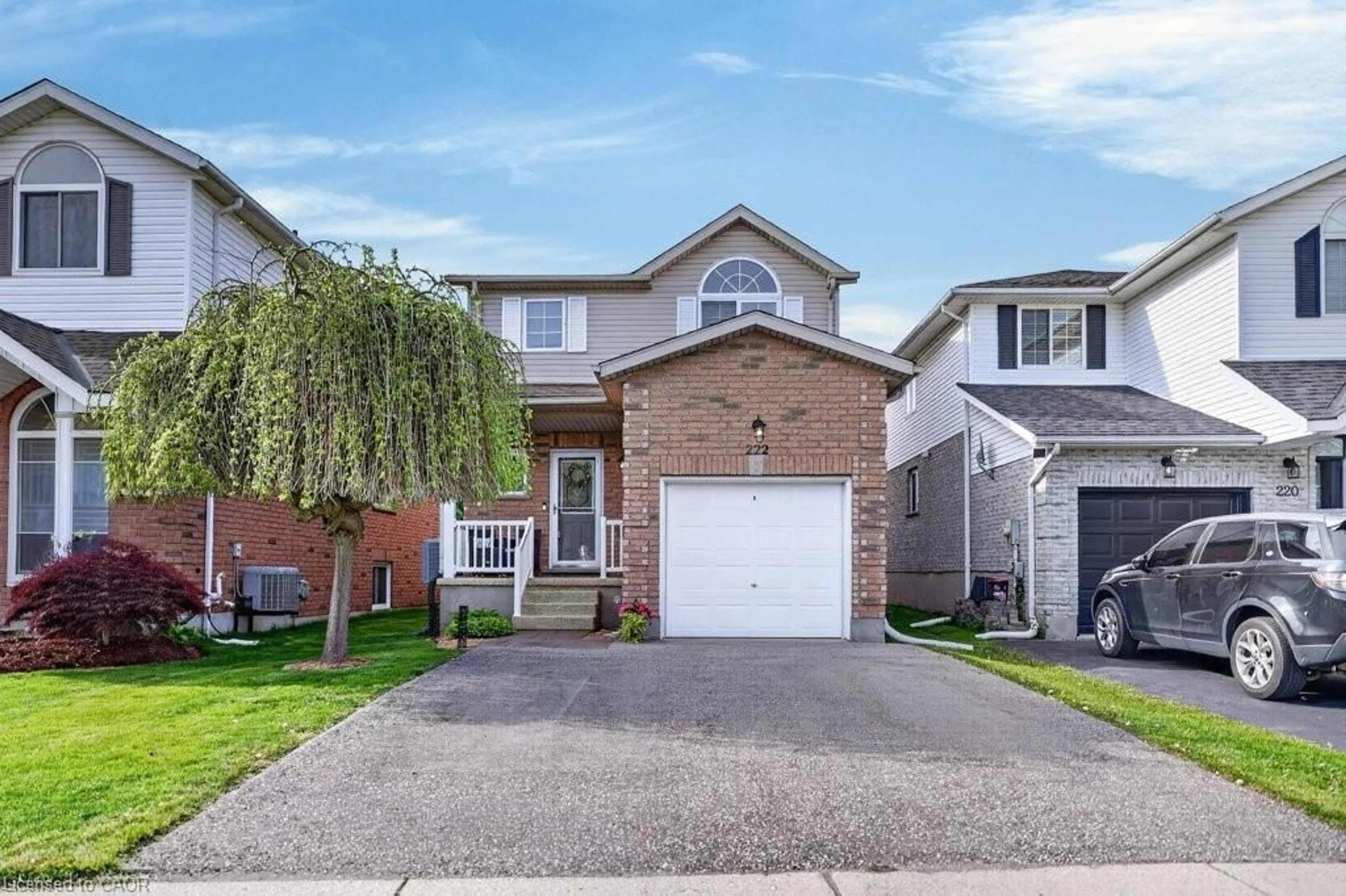Home with brick exterior material, street for 222 Grey Fox Dr, Kitchener Ontario N2E 3N4