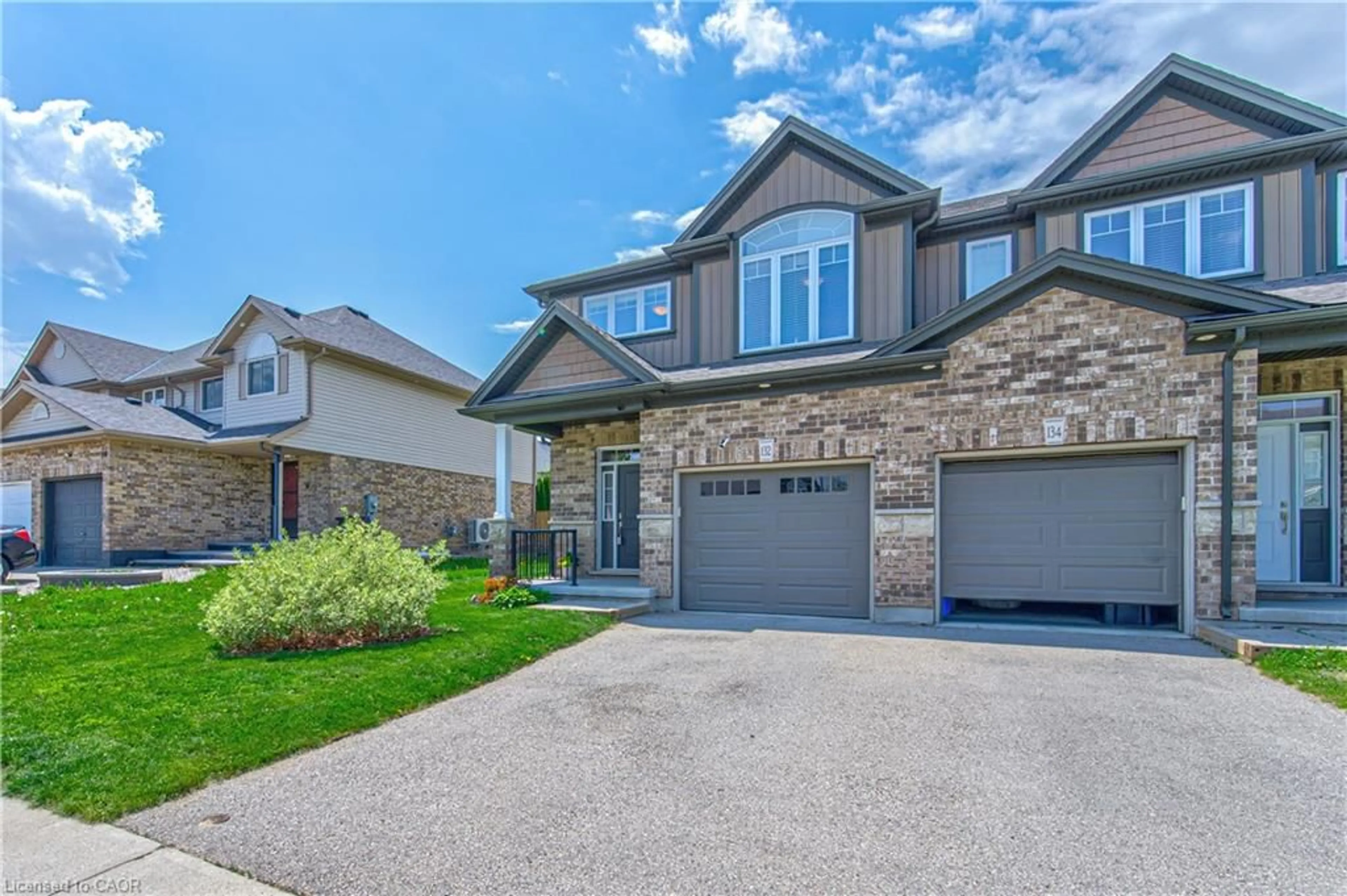 Home with brick exterior material, street for 132 Templewood Dr, Kitchener Ontario N2R 0H5