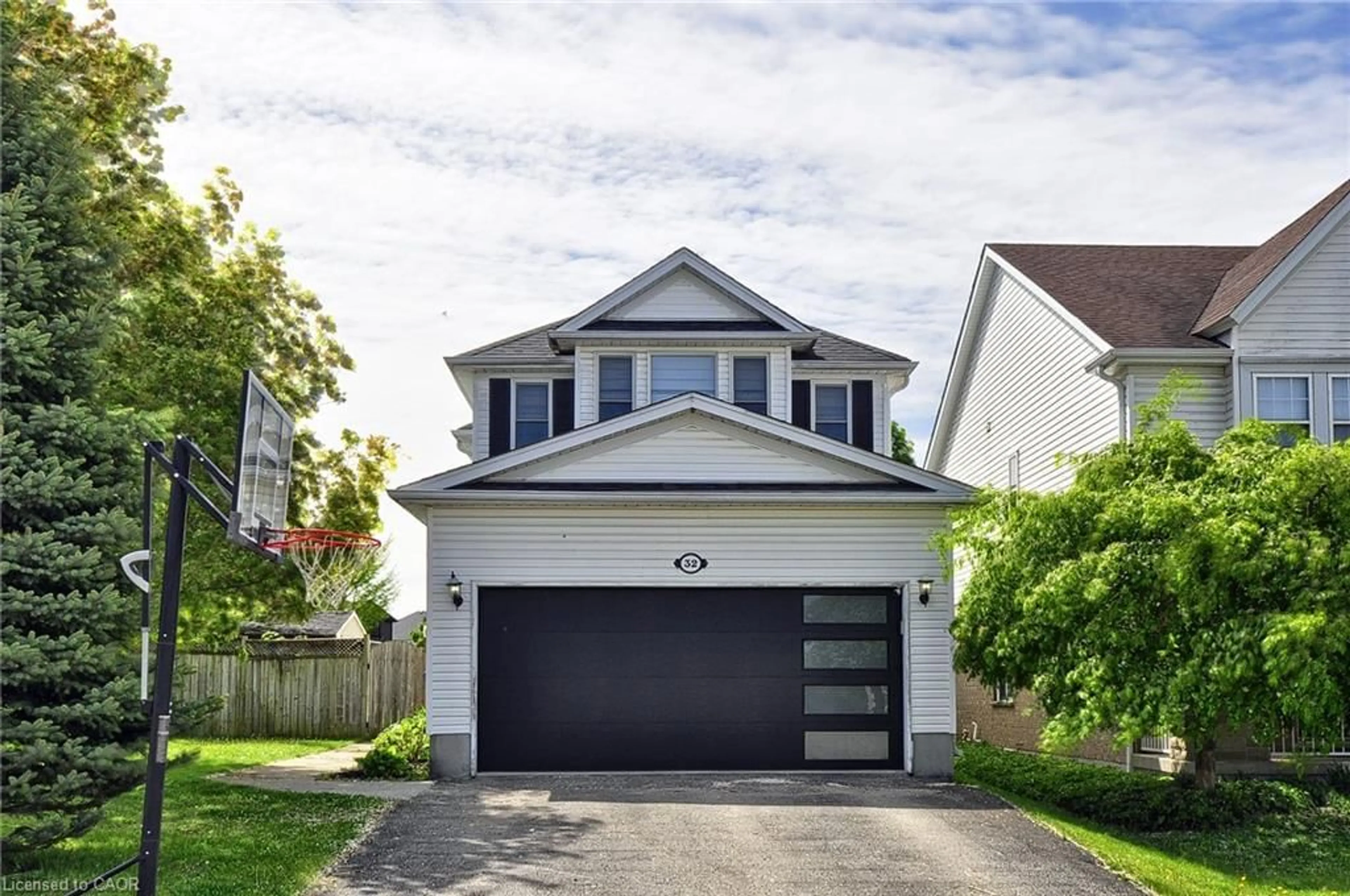 Home with vinyl exterior material, street for 32 Kroeger Cres, Cambridge Ontario N3C 4J7