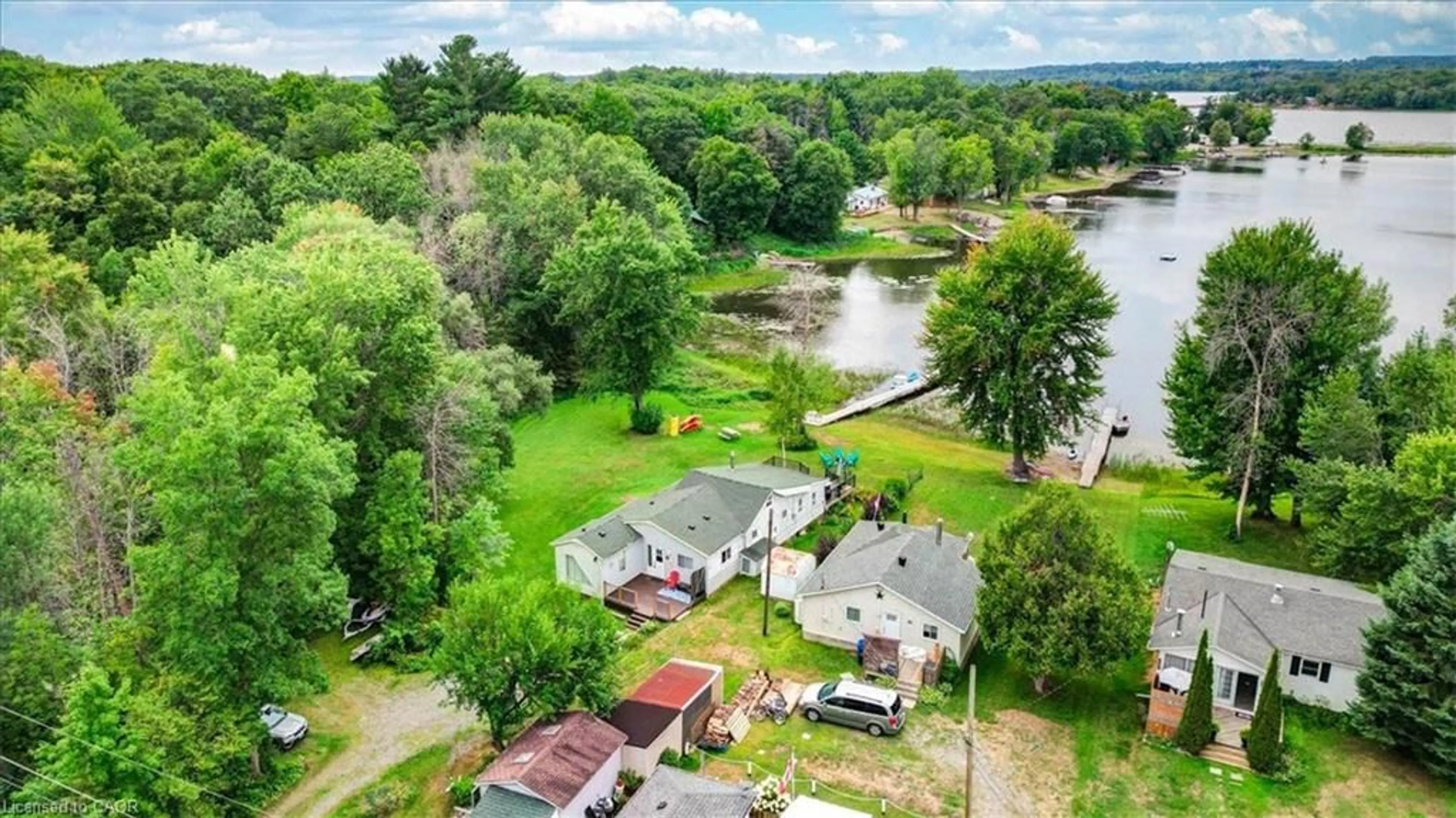 A pic from outside/outdoor area/front of a property/back of a property/a pic from drone, water/lake/river/ocean view for 75 A&B Hughes Lane, Tweed Ontario K0K 3J0