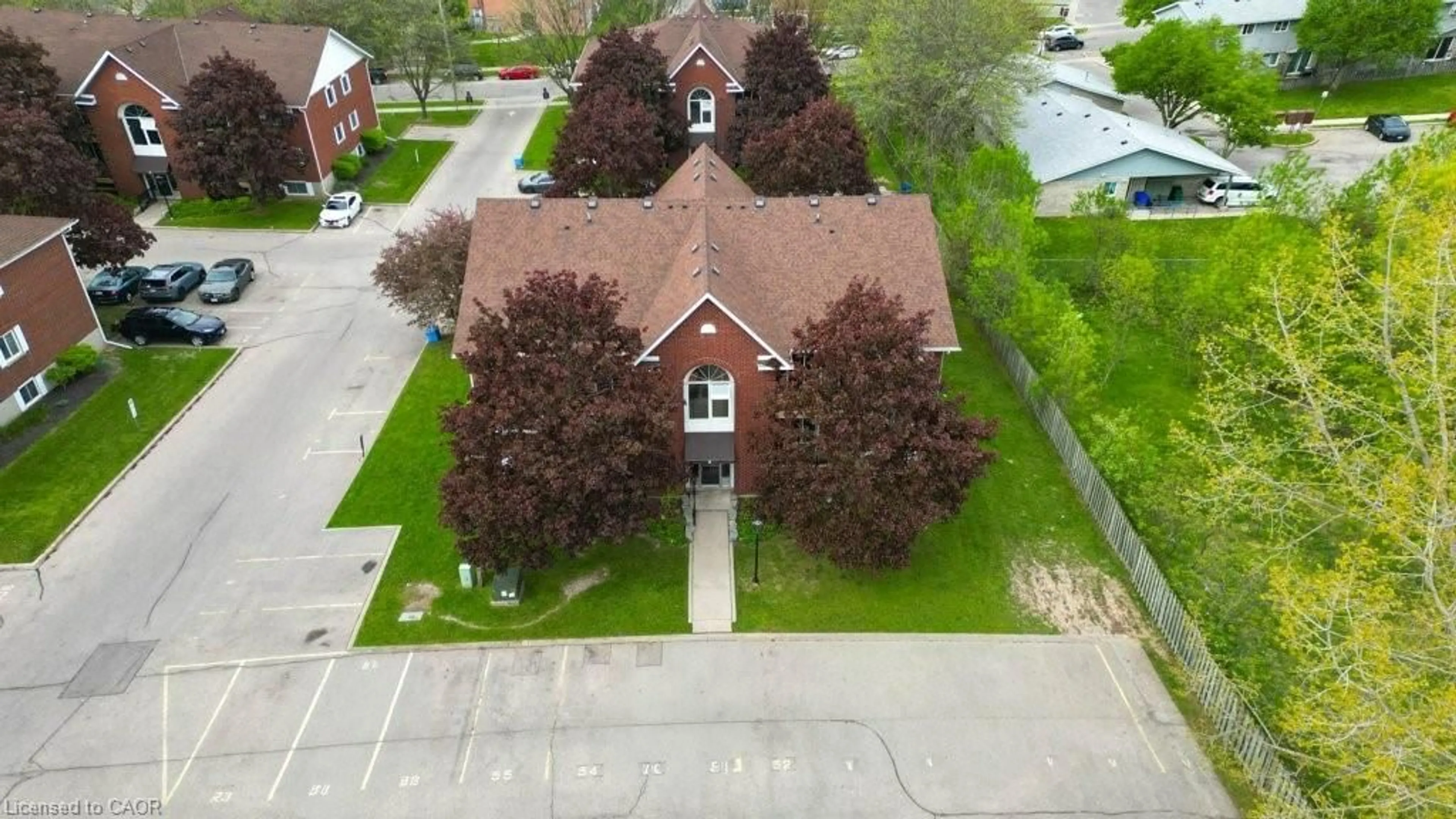 A pic from outside/outdoor area/front of a property/back of a property/a pic from drone, street for 565 Greenfield Ave #212, Kitchener Ontario N2C 2P3