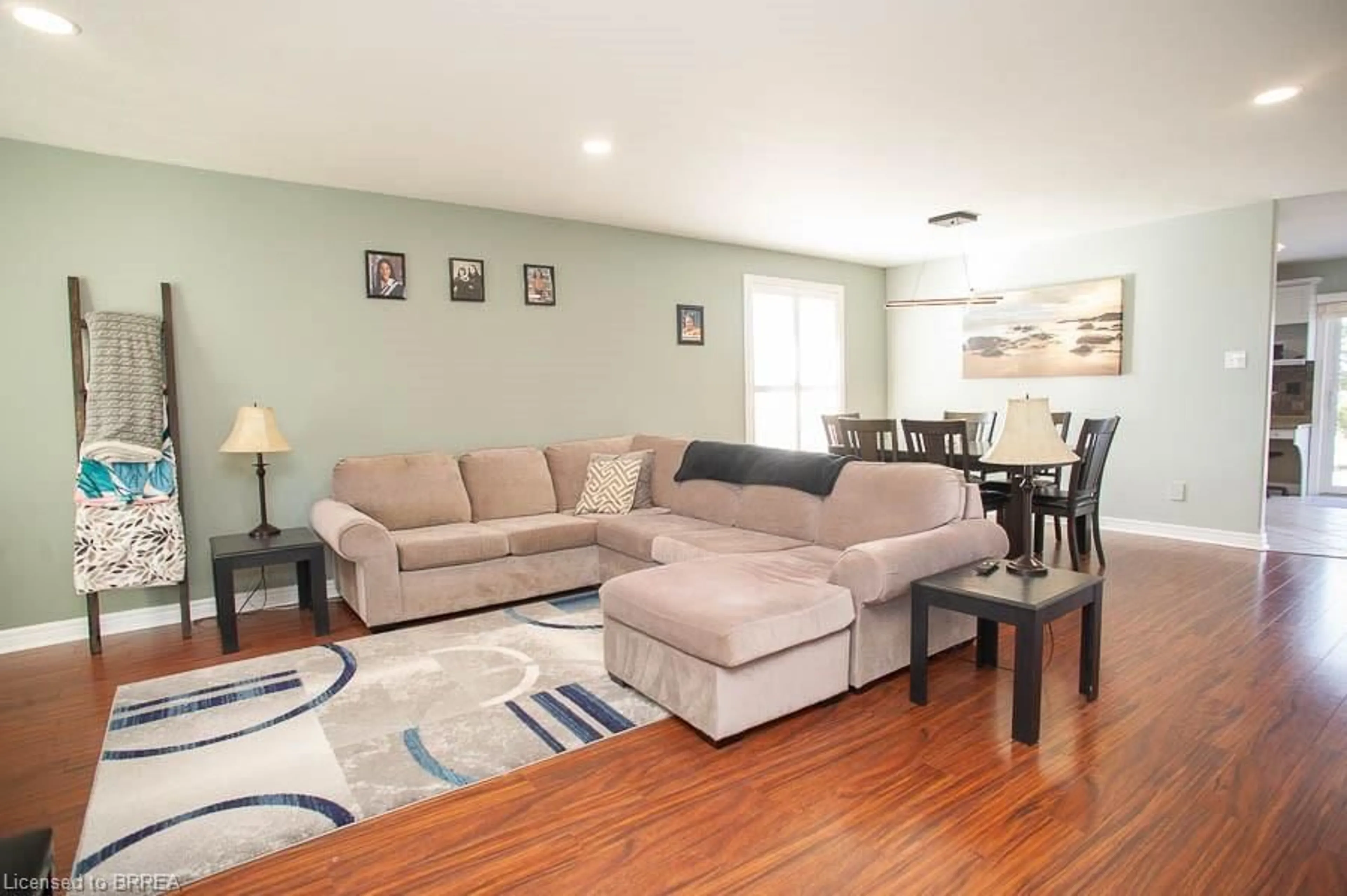 Living room with furniture, wood/laminate floor for 307 Brant County Rd 18, Brantford Ontario N3T 5L9