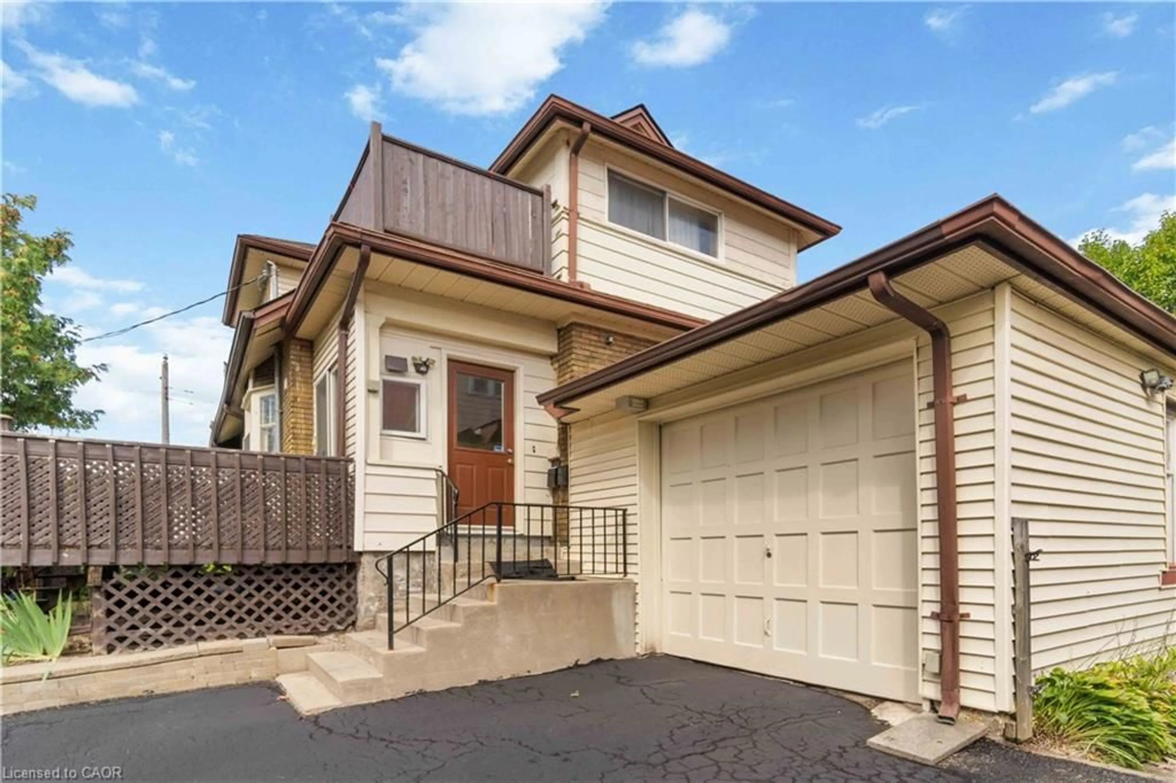 Home with vinyl exterior material, street for 151 Louisa St, Kitchener Ontario N2H 5M4