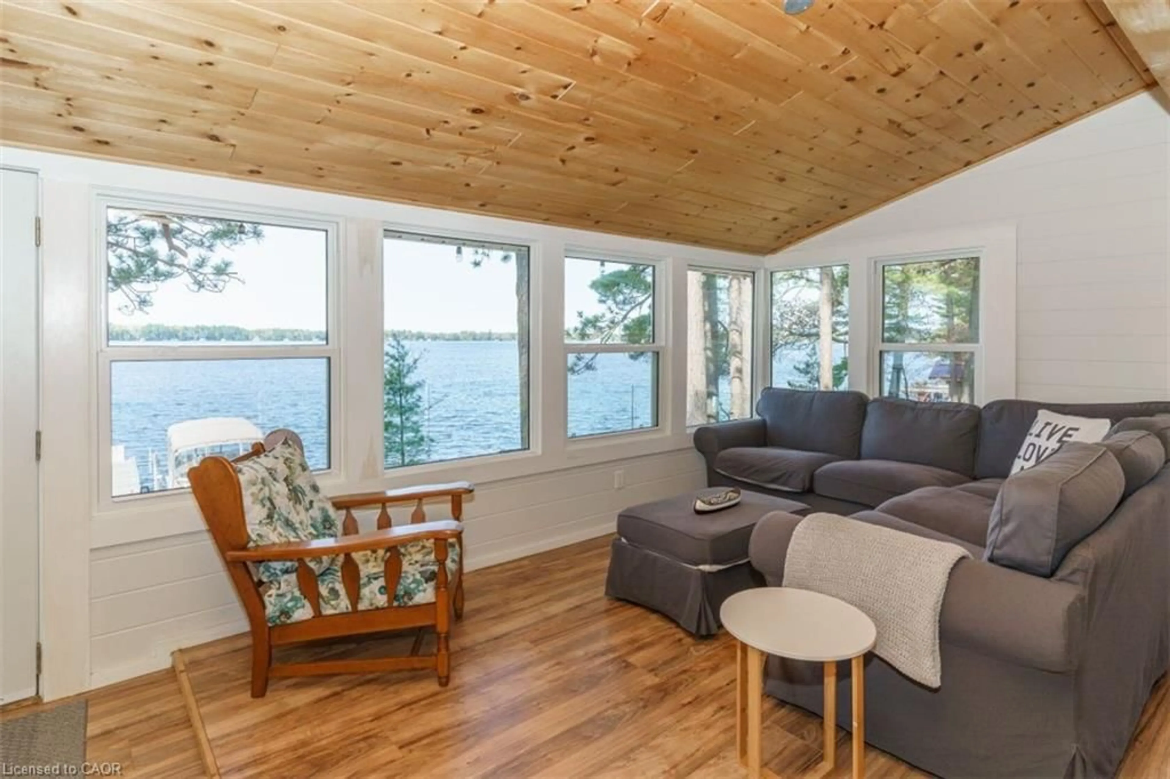 Living room with furniture, wood/laminate floor for 99 Bala Park Island, Bala Ontario P0C 1A0