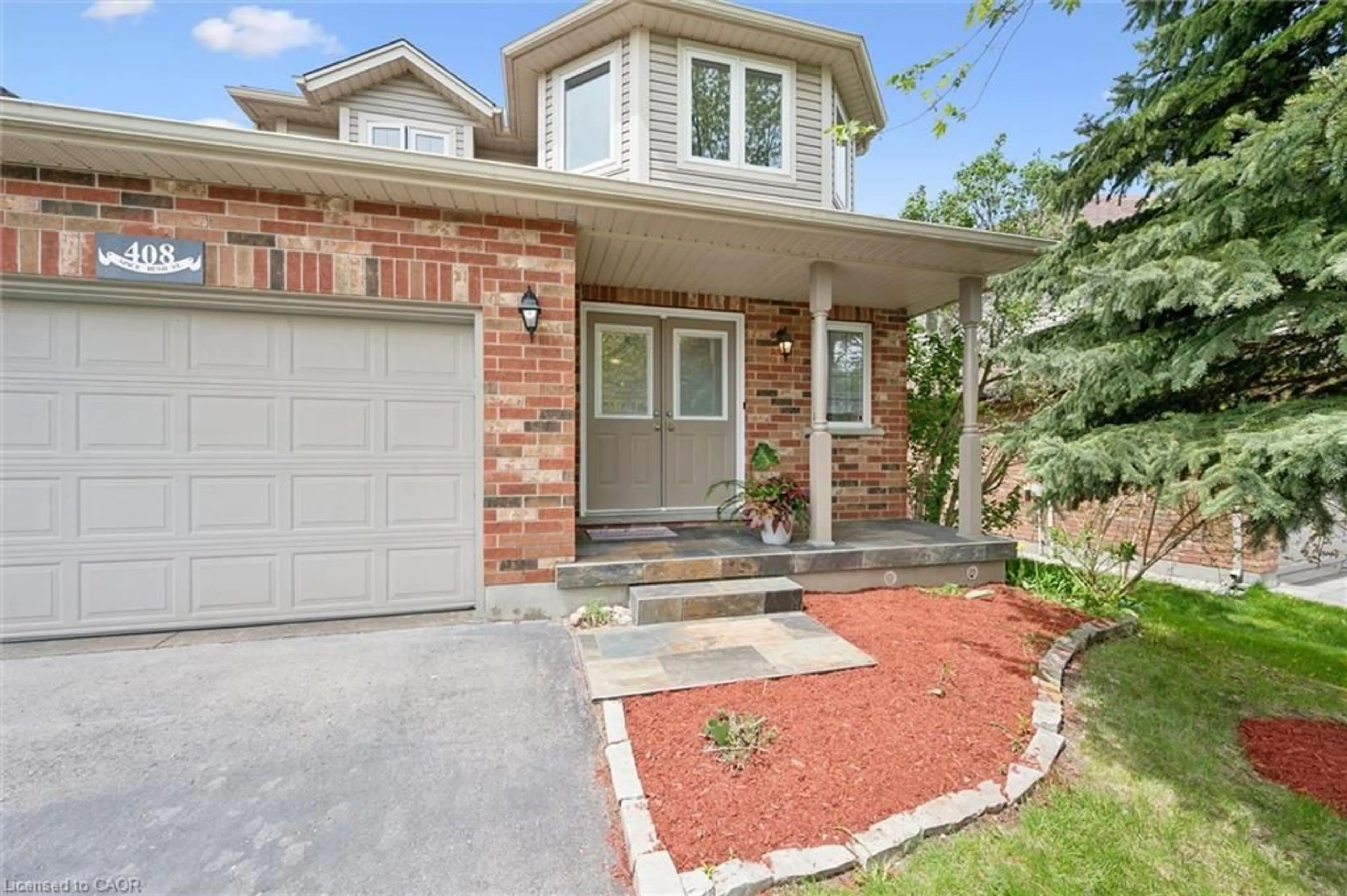 Home with brick exterior material, street for 408 Spice Bush St, Waterloo Ontario N2V 2V6