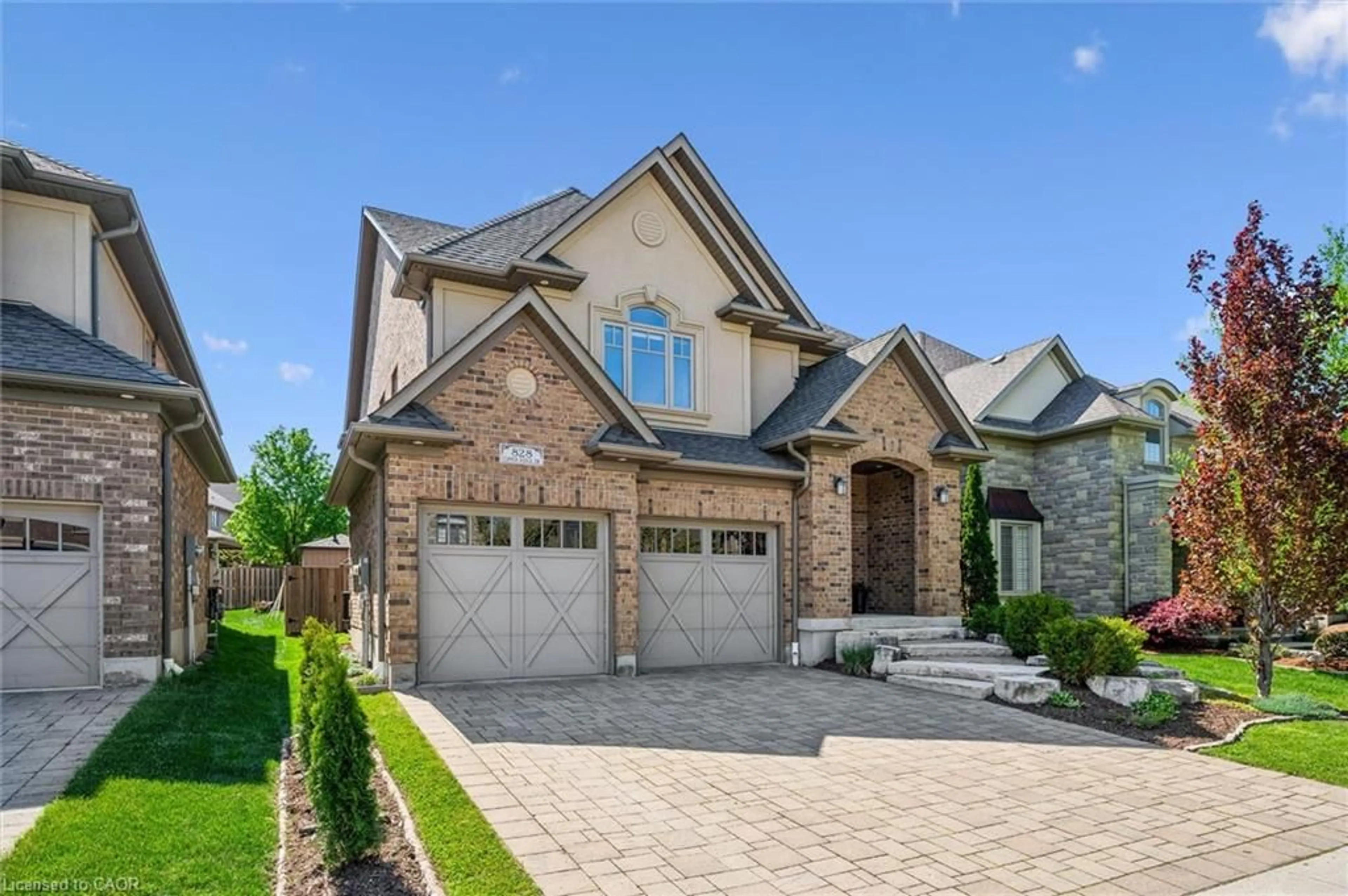 Home with brick exterior material, street for 828 Copper Ridge Dr, Waterloo Ontario N2K 0B5