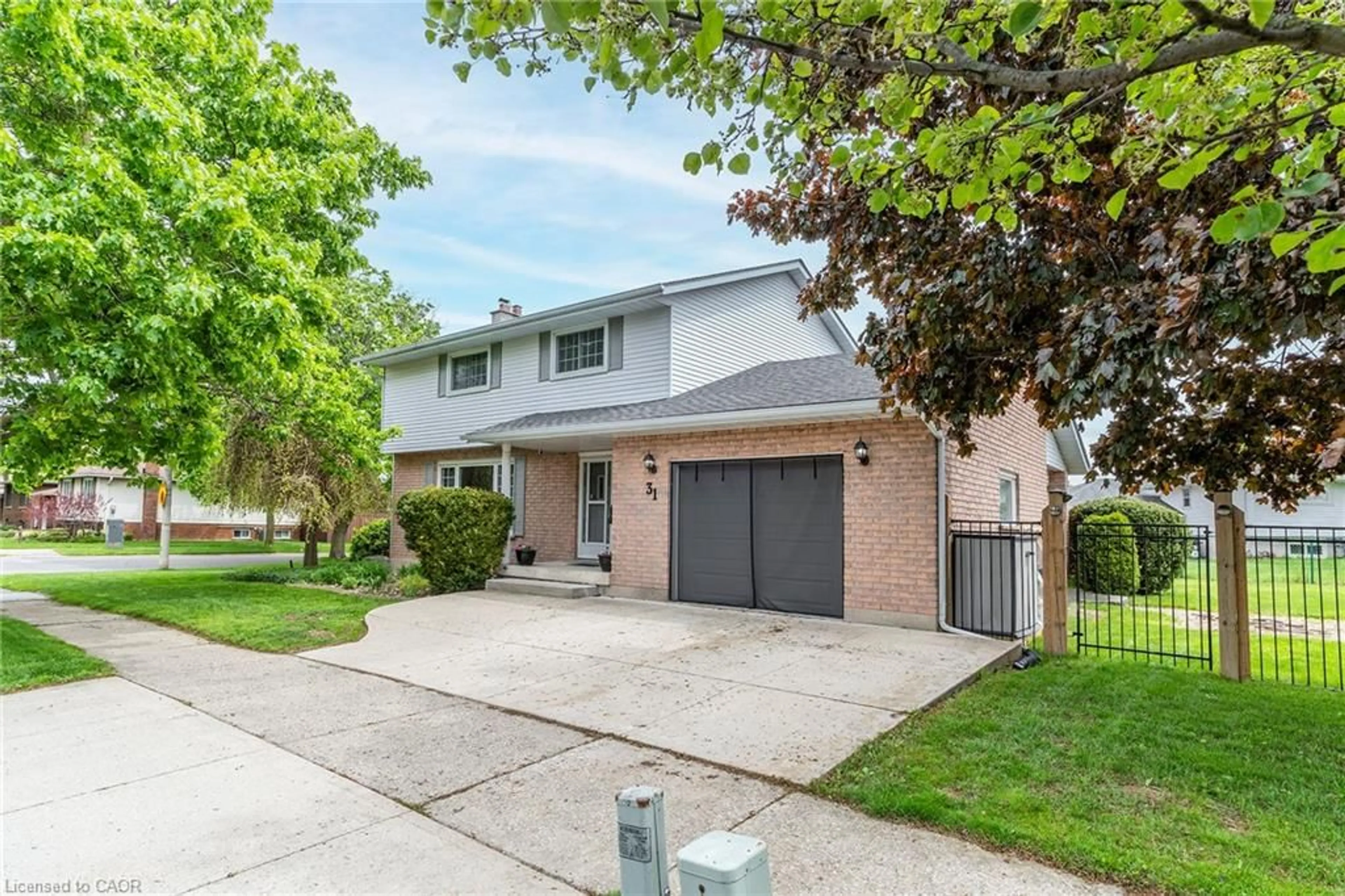 Home with brick exterior material, street for 31 Blackfriar Lane, Brantford Ontario N3R 7M2