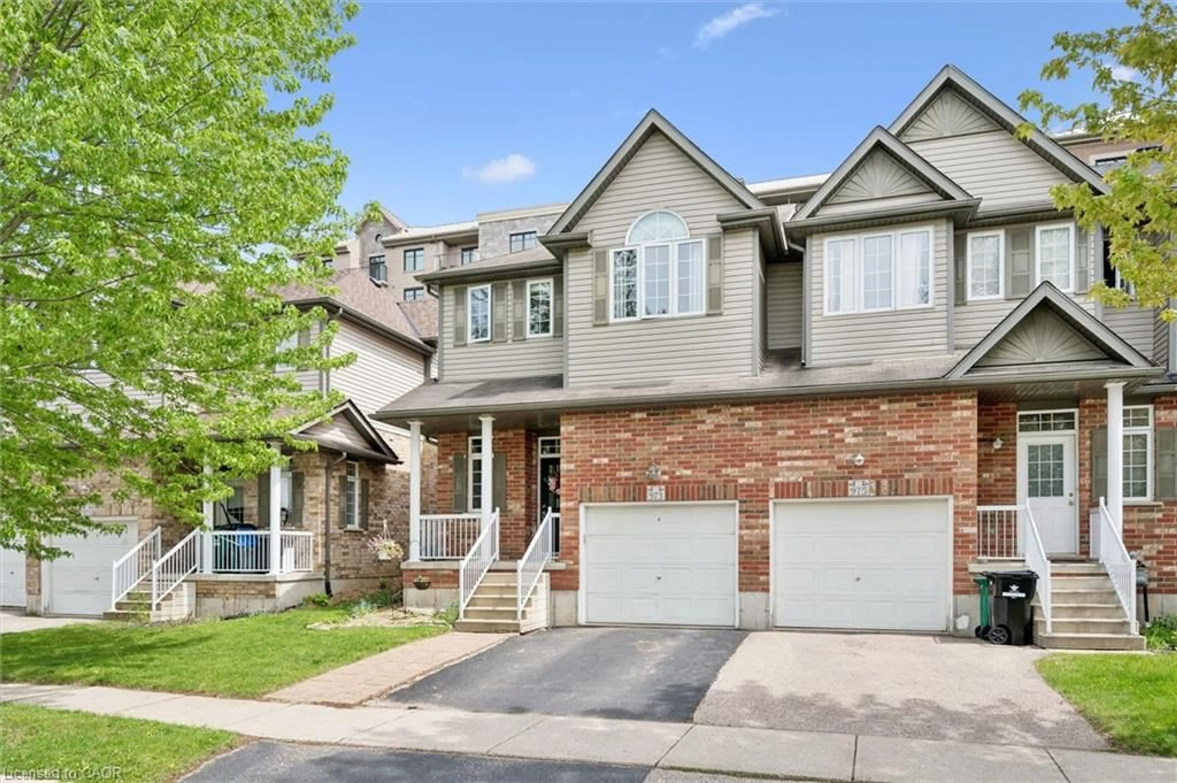 Home with brick exterior material, street for 973 Creekside Dr, Waterloo Ontario N2V 2W5