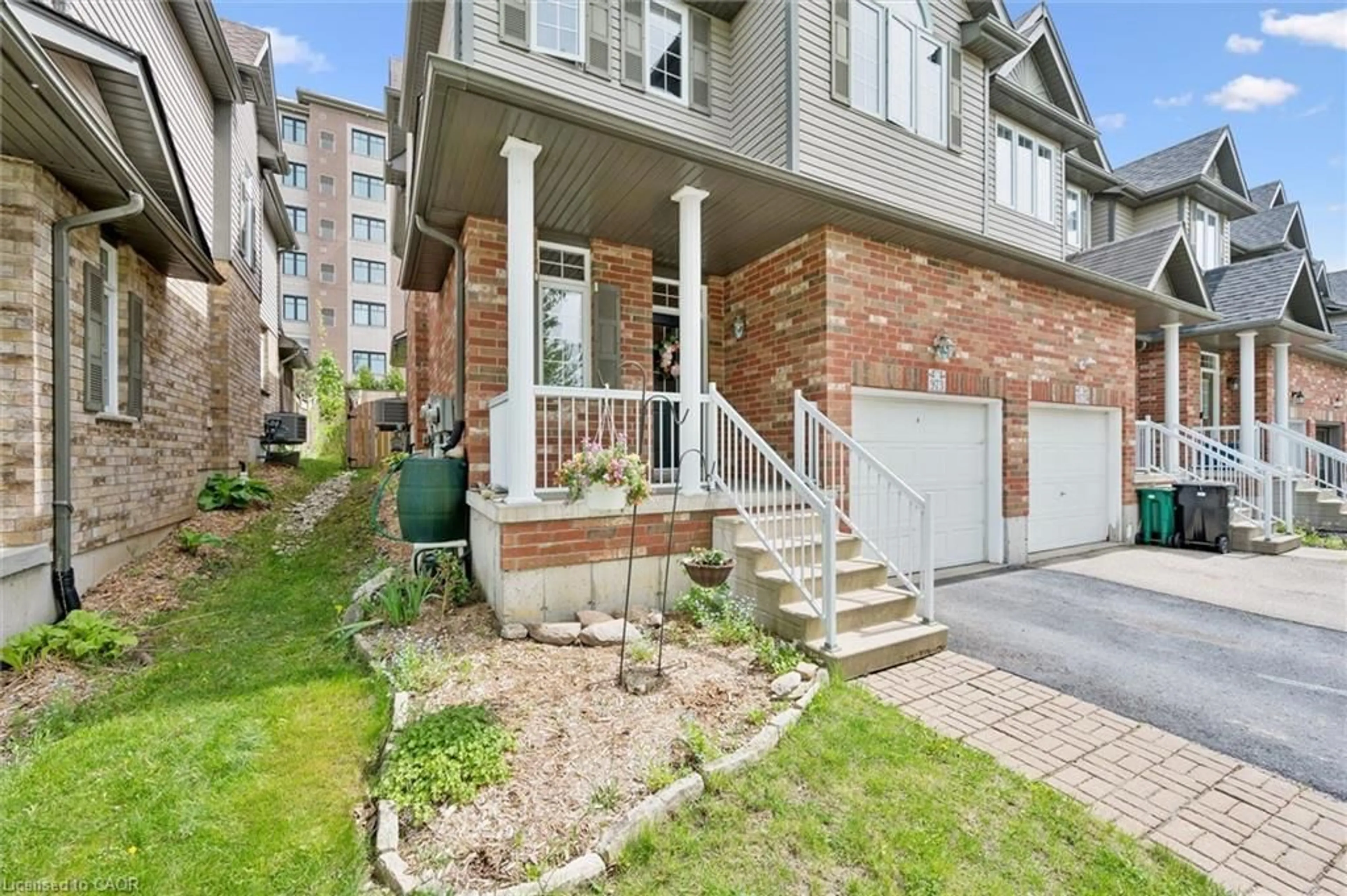 Home with brick exterior material, street for 973 Creekside Dr, Waterloo Ontario N2V 2W5