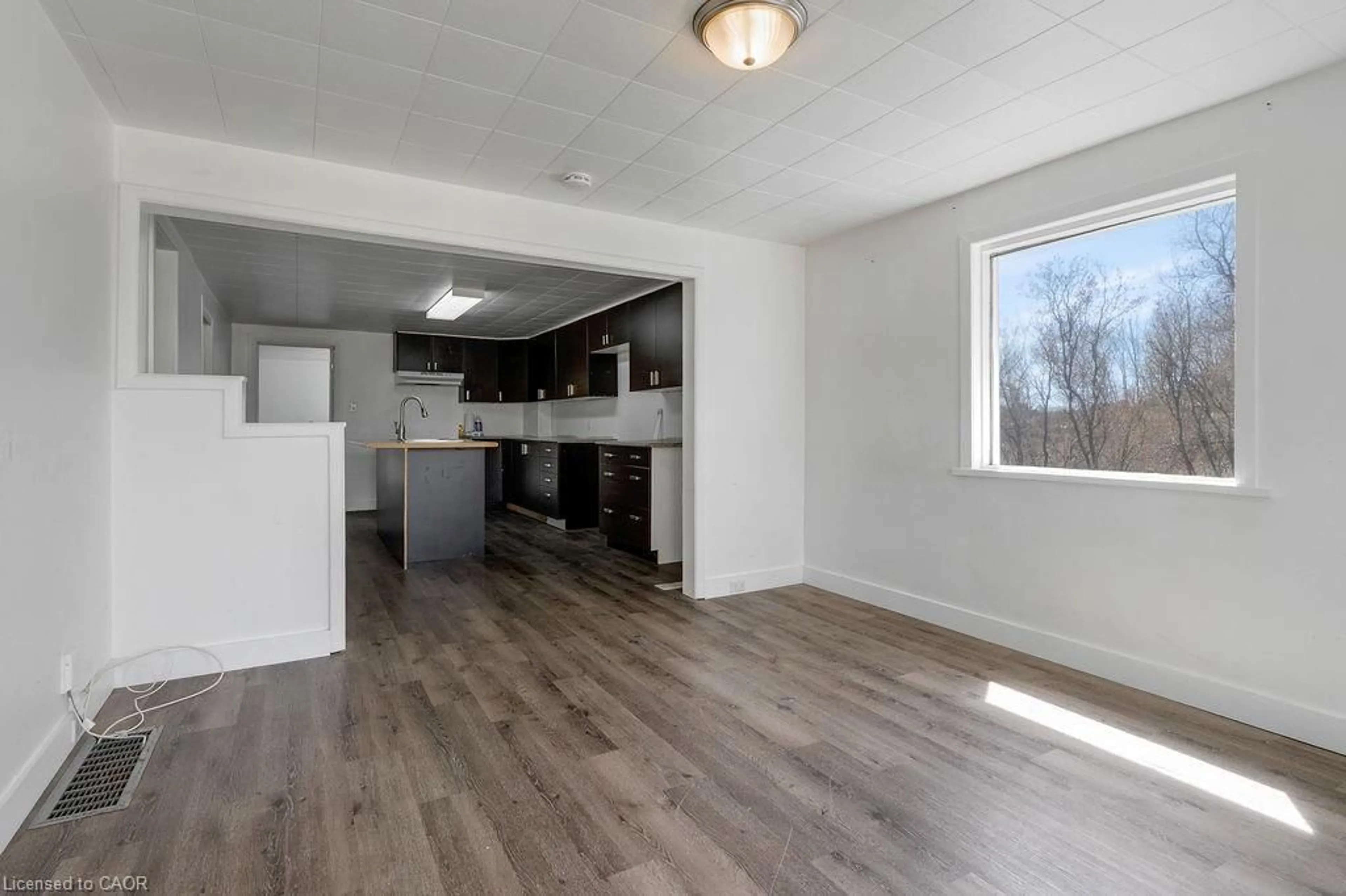 Open concept kitchen, wood/laminate floor for 34 Ramsay St, Sturgeon Falls Ontario P2B 3G7