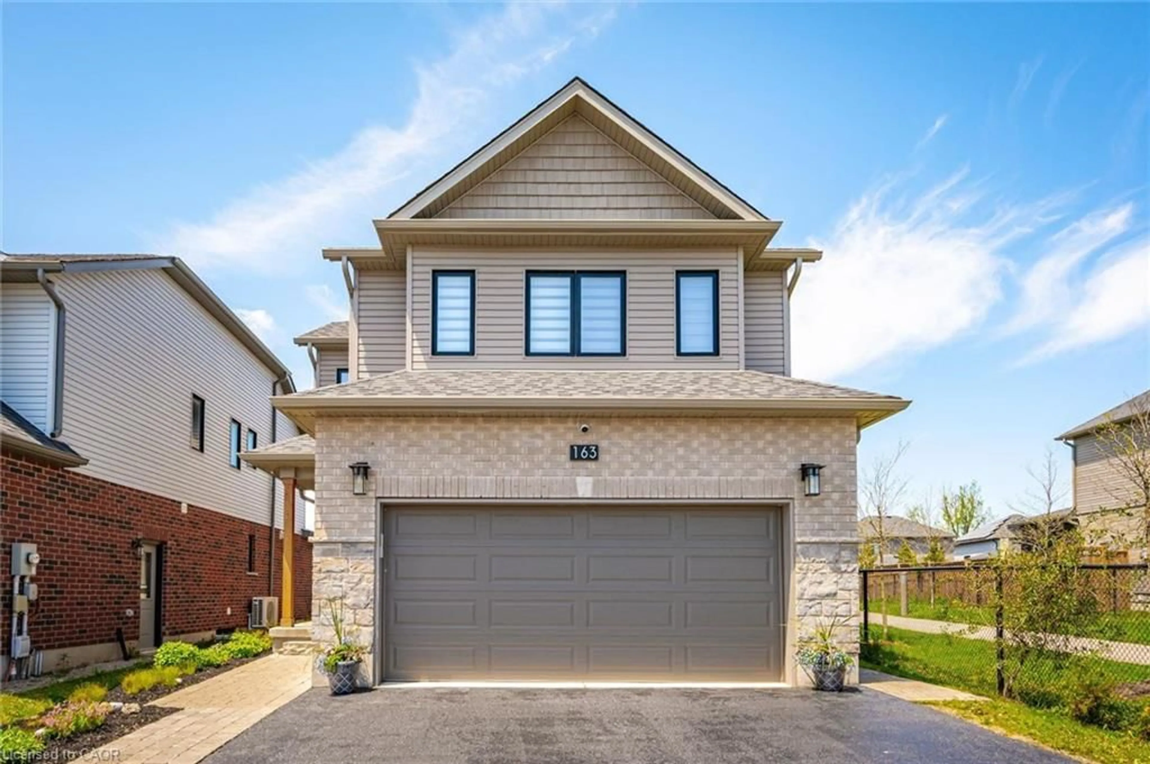 Home with brick exterior material, street for 163 Halls Dr, Elora Ontario N0B 1S0