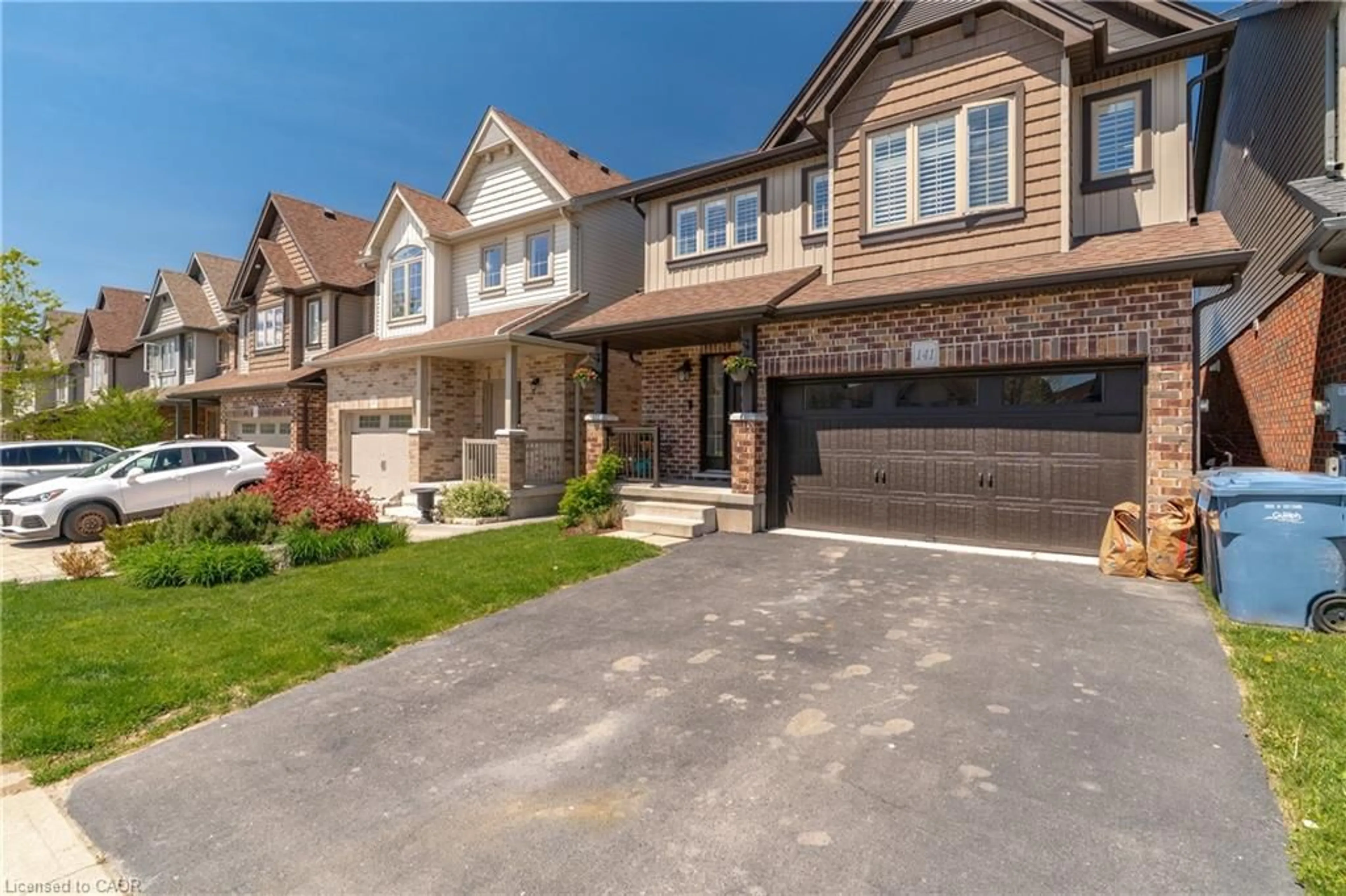Home with brick exterior material, street for 141 Couling Cres, Guelph Ontario N1E 0K9