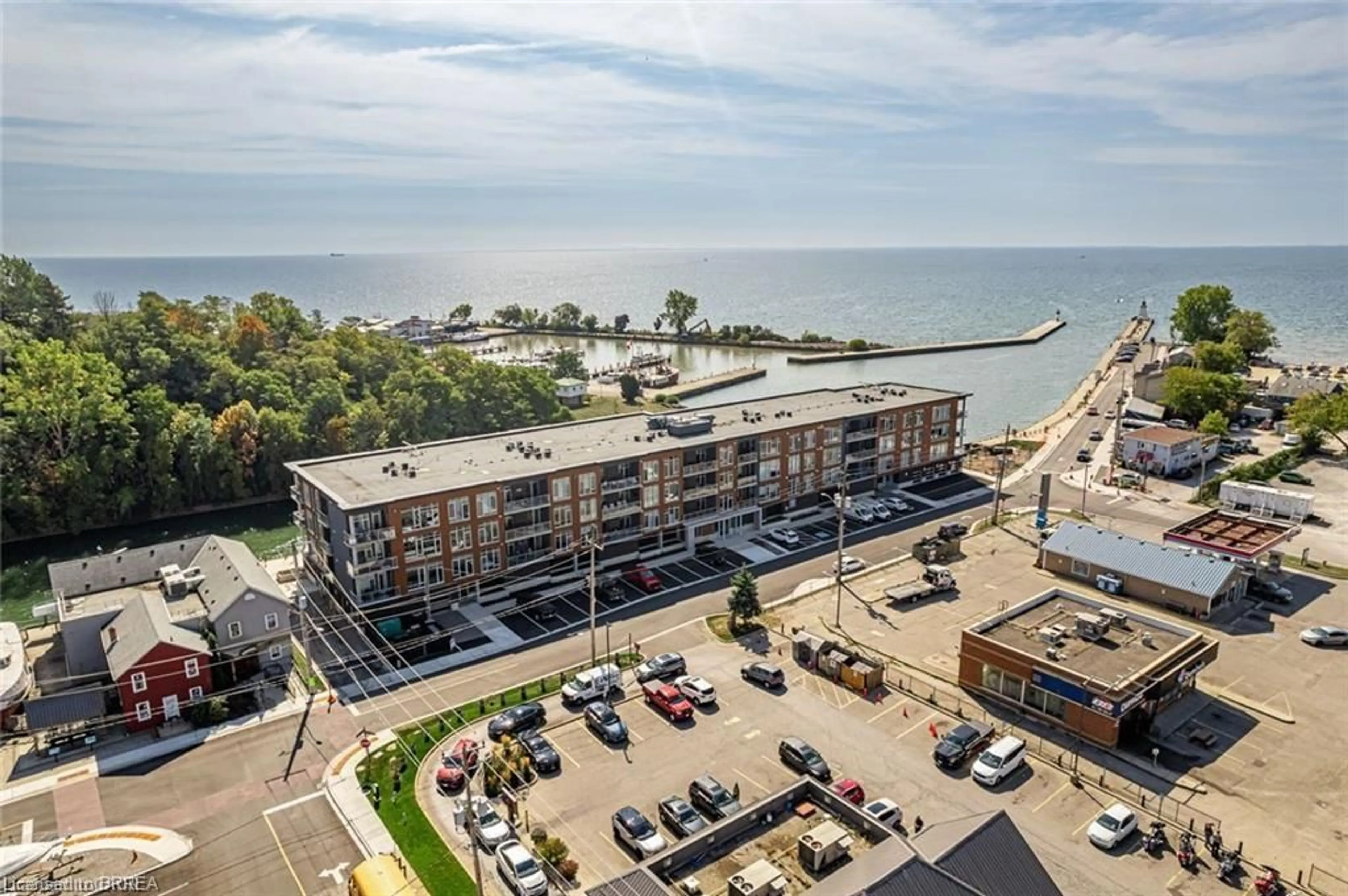 A pic from outside/outdoor area/front of a property/back of a property/a pic from drone, water/lake/river/ocean view for 38 Harbour St #306, Port Dover Ontario N0A 1N0