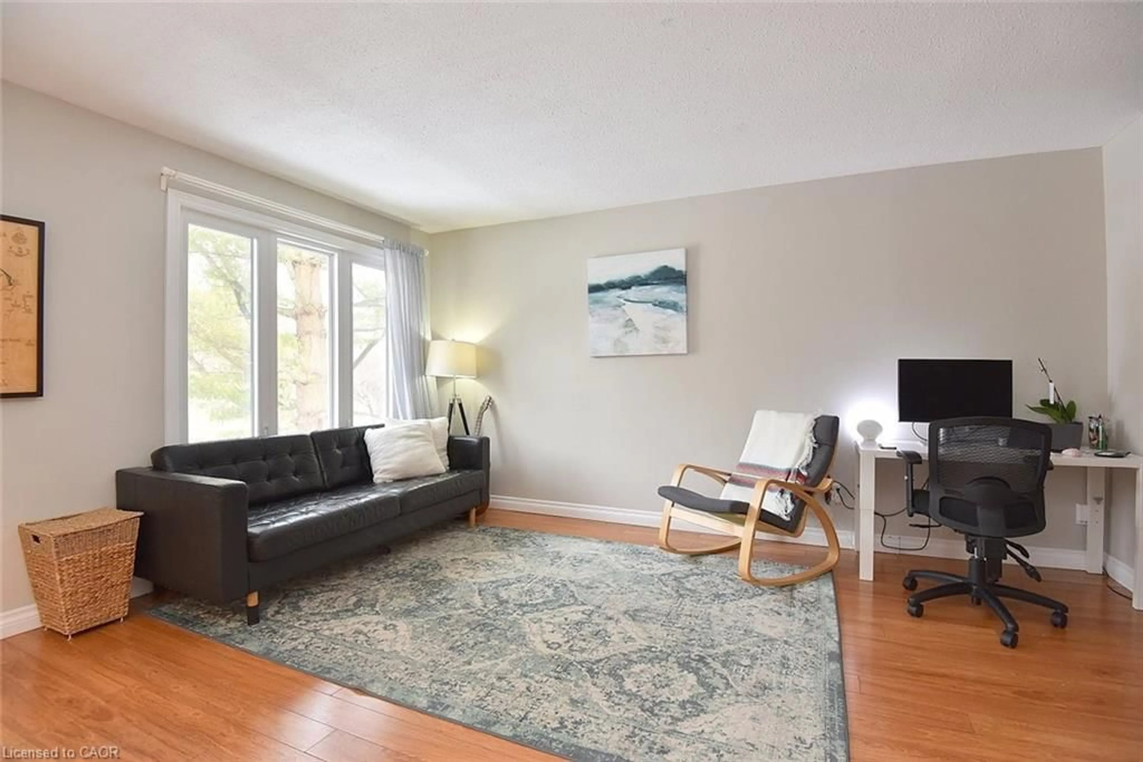 Living room with furniture, wood/laminate floor for 109 Wilson St #15, Ancaster Ontario L9G 1N4