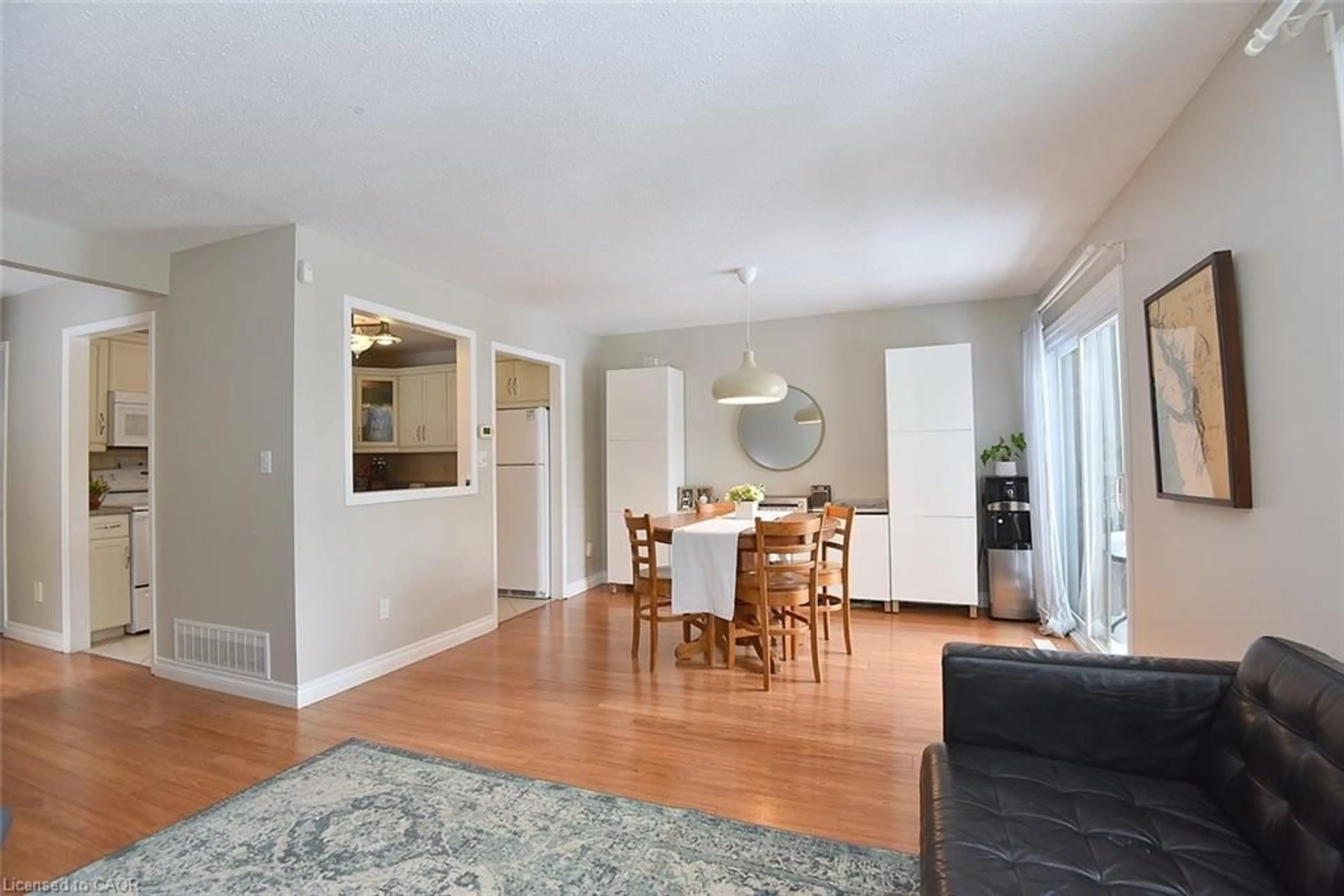 Living room with furniture, wood/laminate floor for 109 Wilson St #15, Ancaster Ontario L9G 1N4