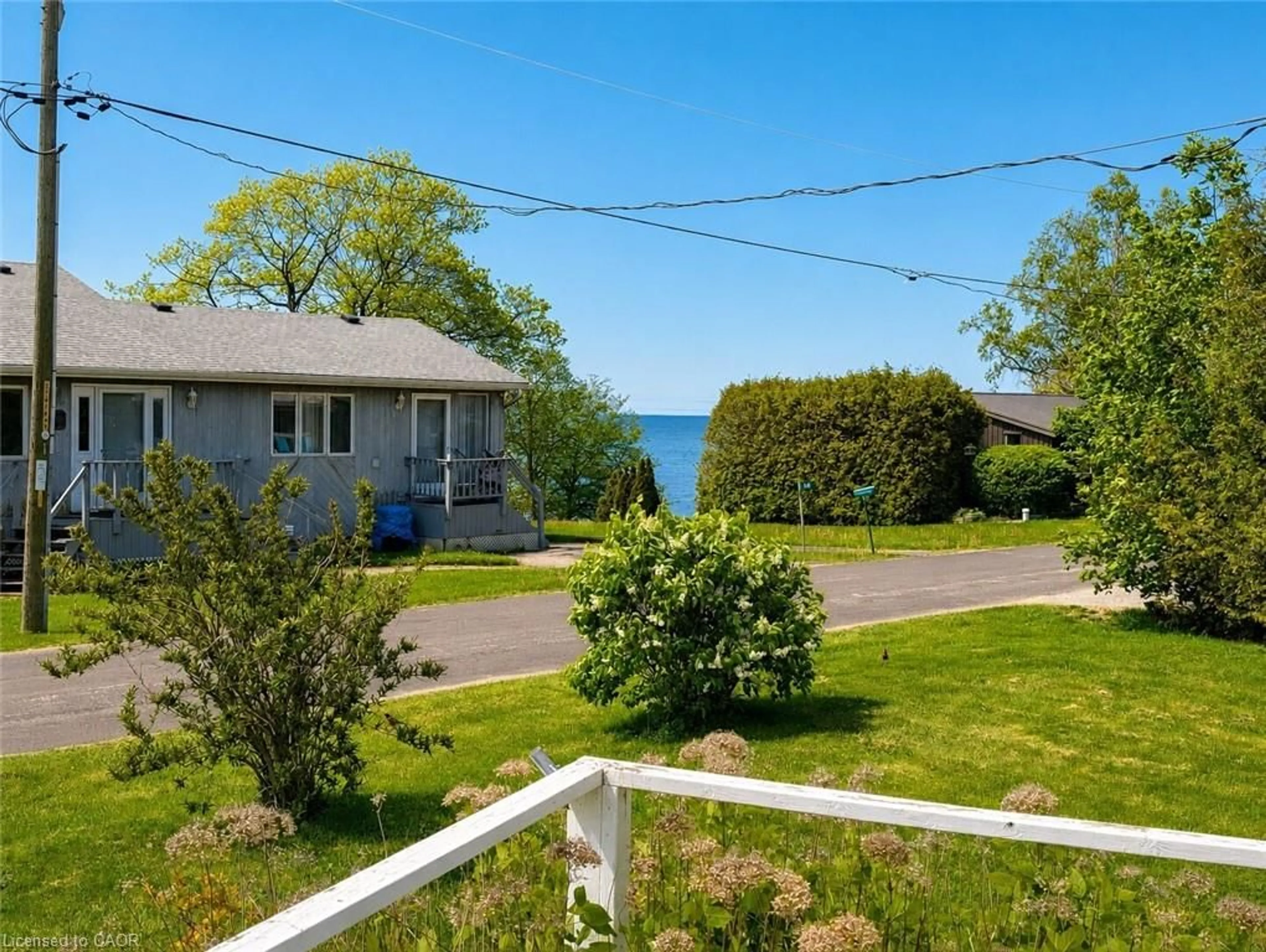 A pic from outside/outdoor area/front of a property/back of a property/a pic from drone, water/lake/river/ocean view for 18 Kenneth Ave, Port Dover Ontario N0A 1N3