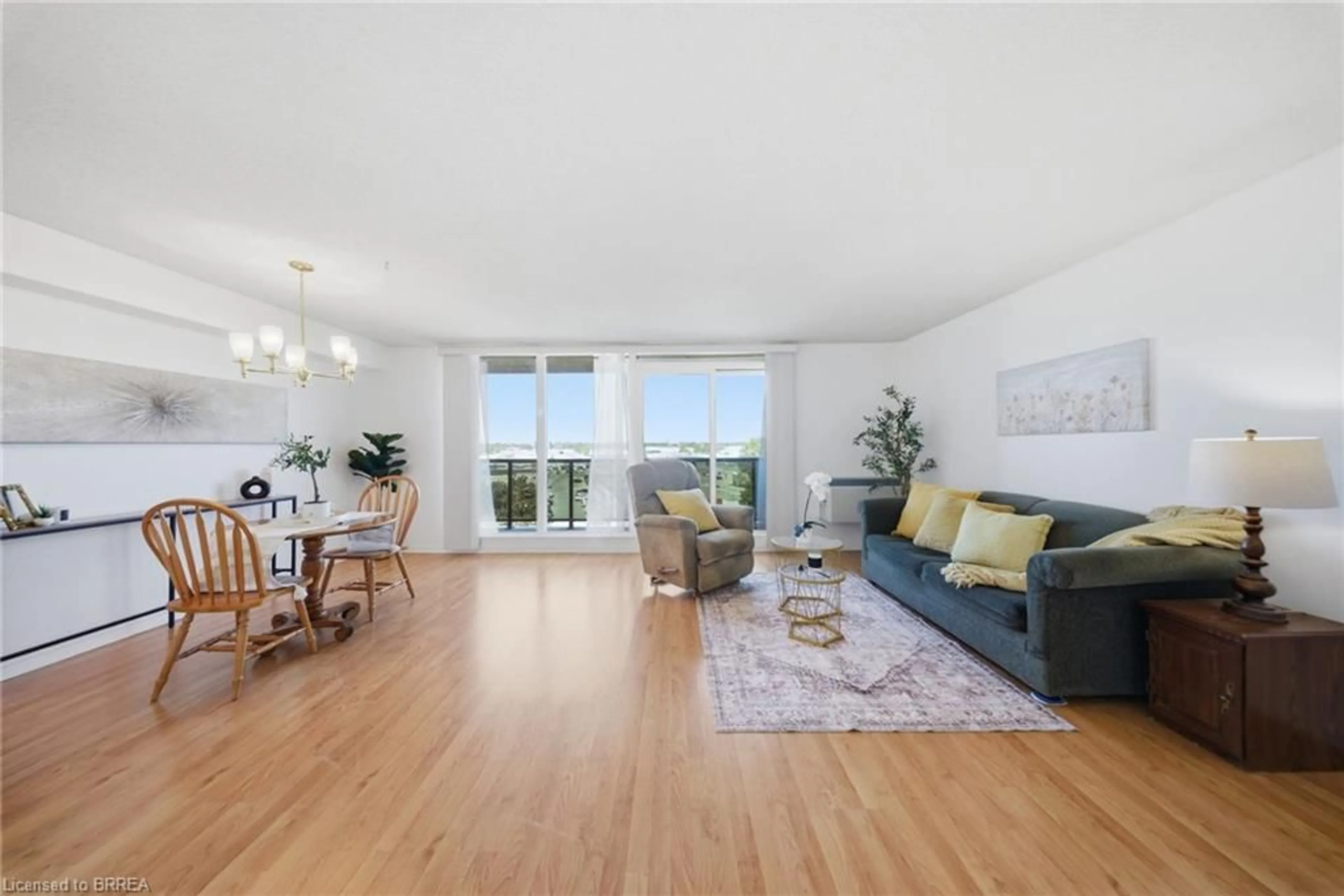 Living room with furniture, wood/laminate floor for 9 Bonheur Crt #716, Brantford Ontario N3P 1Z5