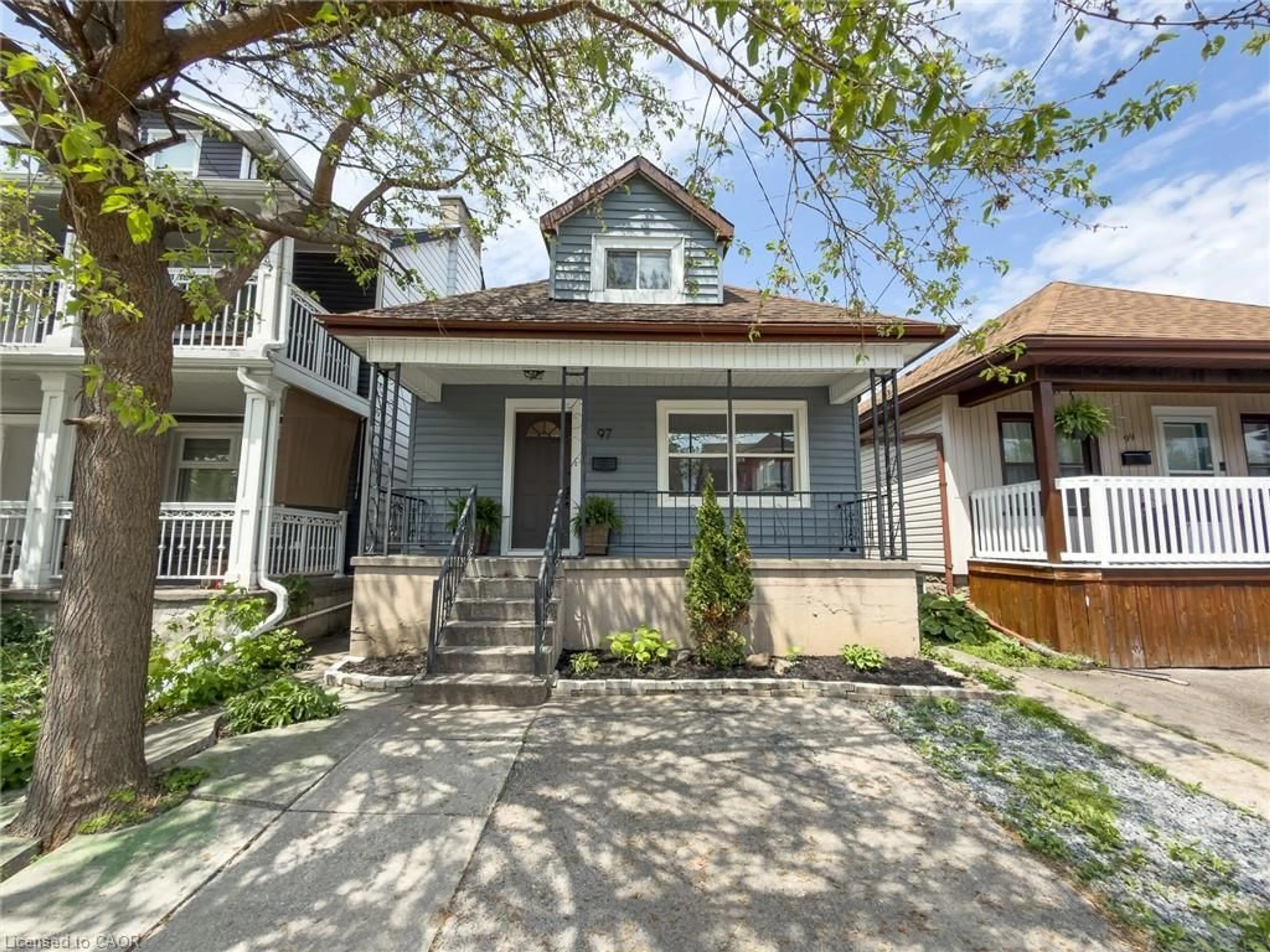 Home with vinyl exterior material, street for 97 Crosthwaite Ave, Hamilton Ontario L8H 2V3
