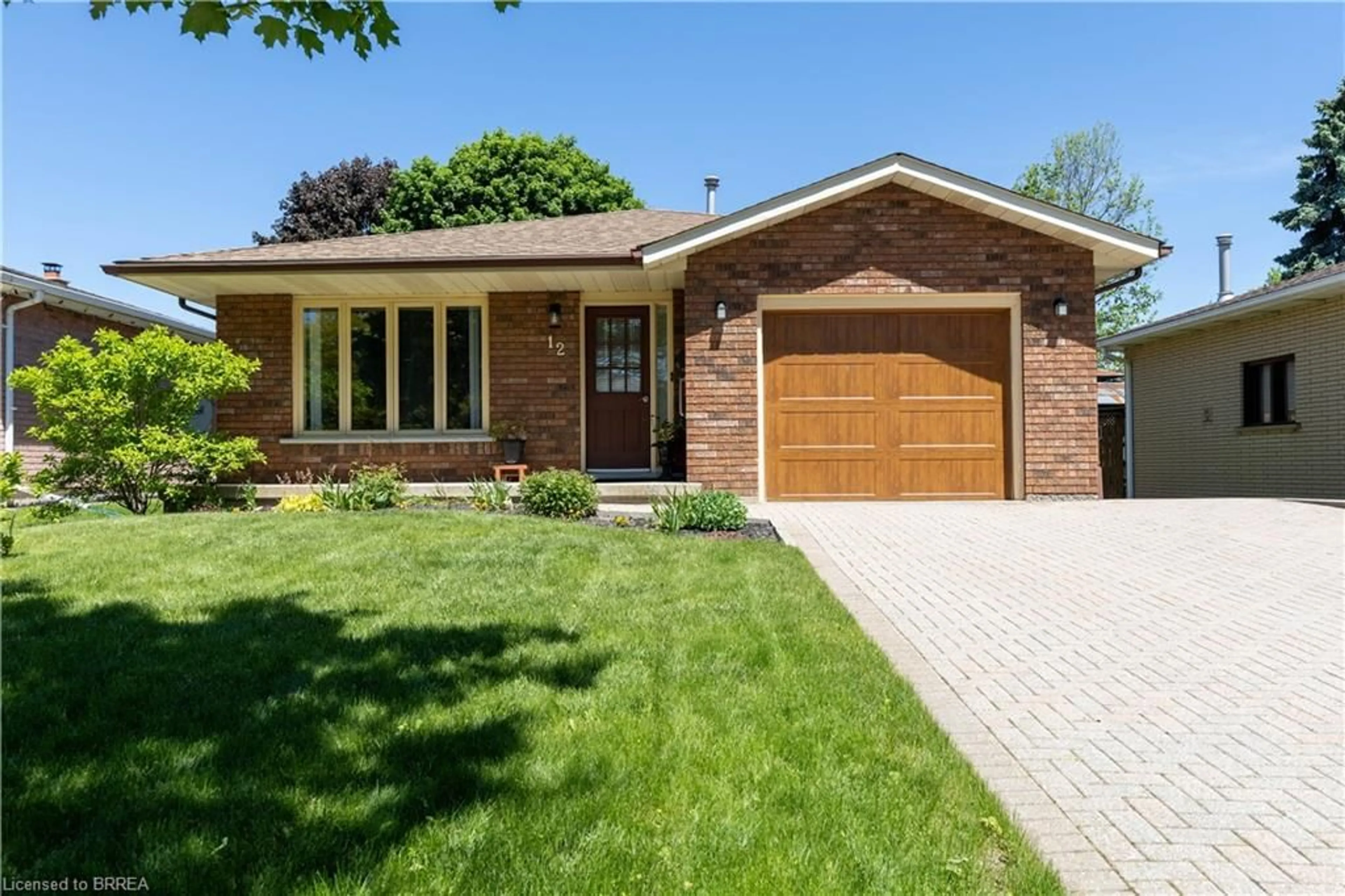 Home with brick exterior material, street for 12 Spartan Dr, Brantford Ontario N3R 6C7