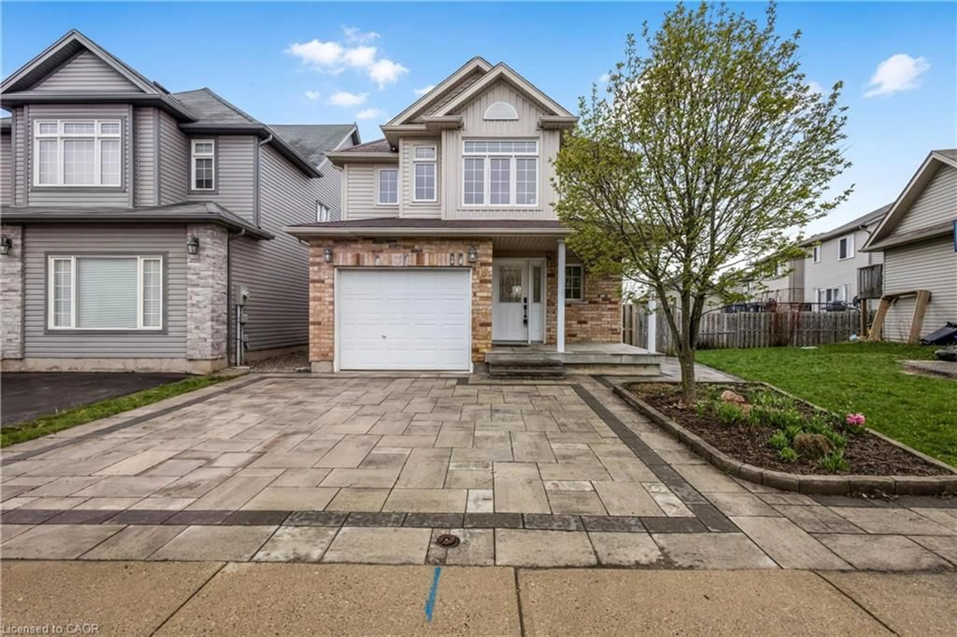 Home with brick exterior material, street for 102 Iron Gate St, Kitchener Ontario N2N 3R6