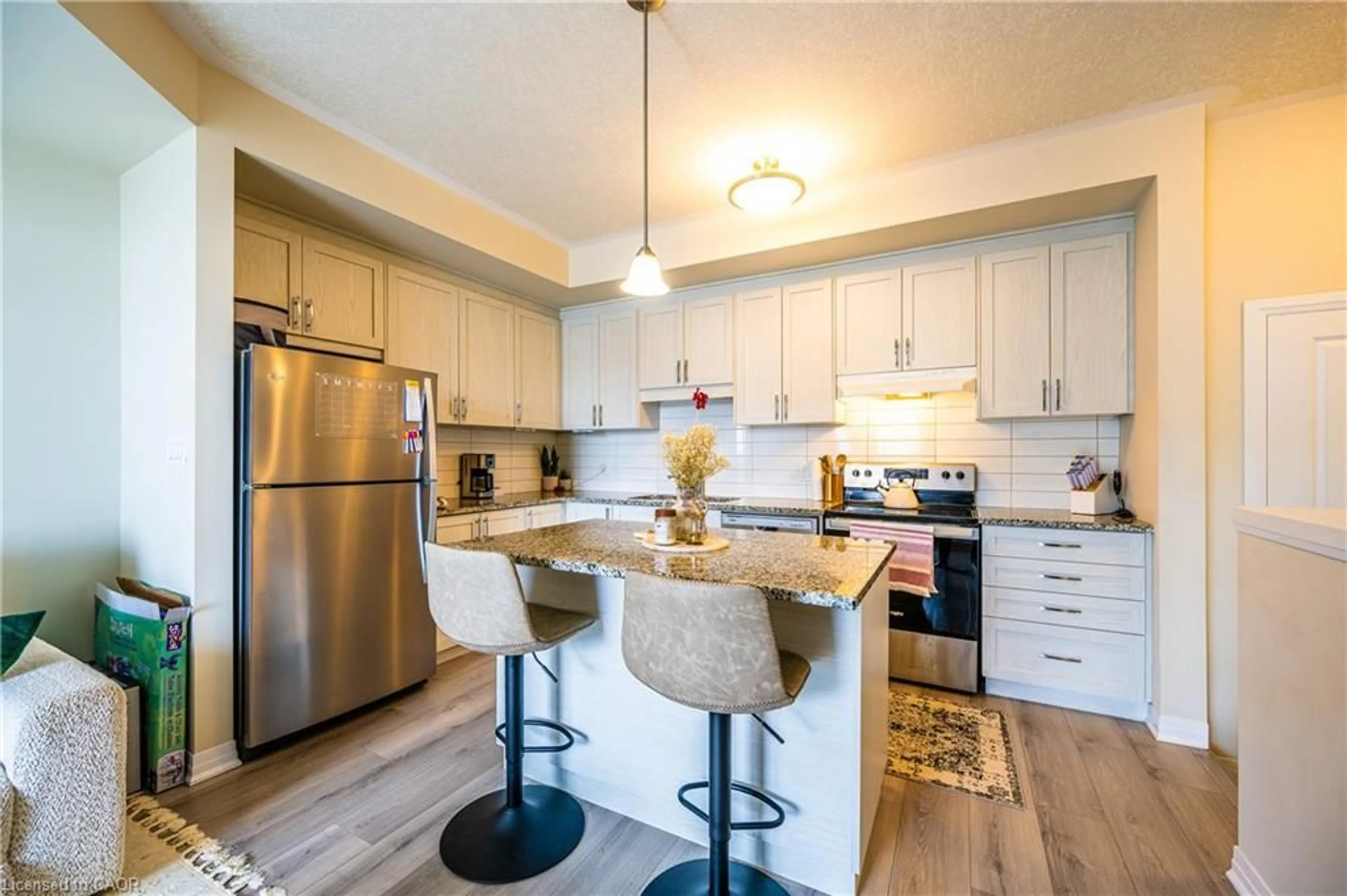 Open concept kitchen, wood/laminate floor for 142 Foamflower Pl #7, Waterloo Ontario N2V 0J1