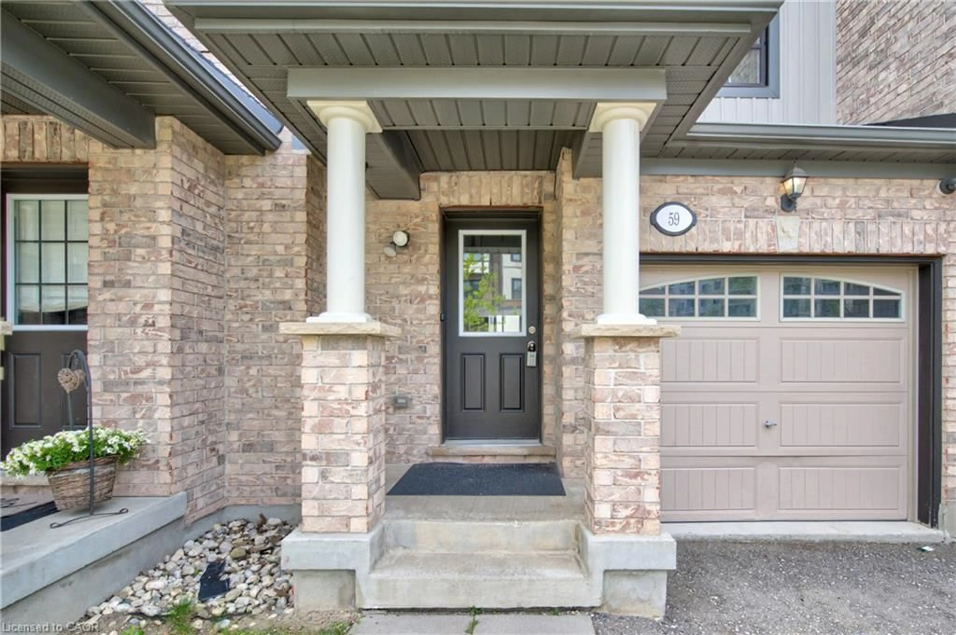 Home with brick exterior material, street for 701 Homer Watson Blvd #59, Kitchener Ontario N2C 0B5