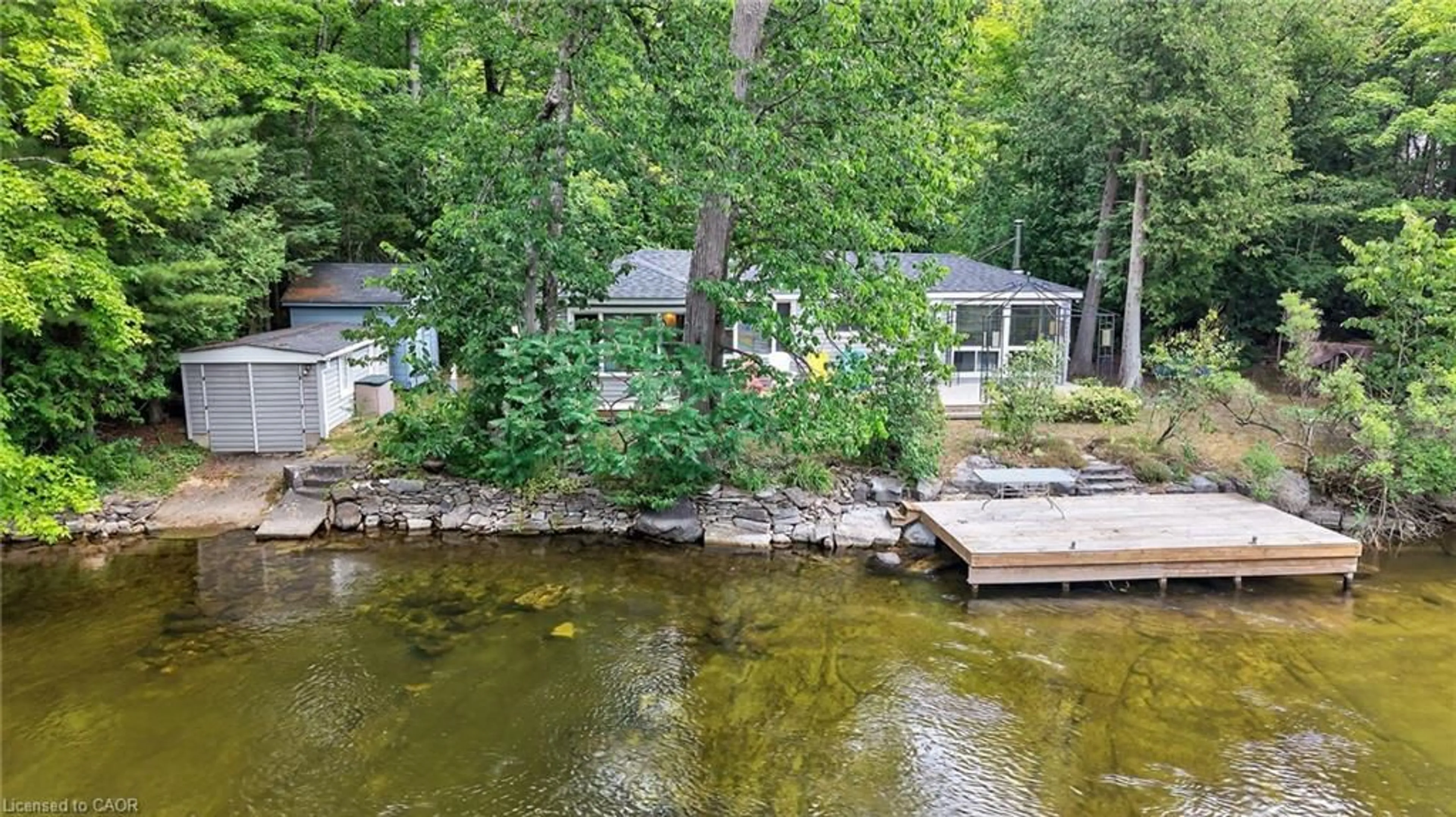 A pic from outside/outdoor area/front of a property/back of a property/a pic from drone, water/lake/river/ocean view for 92 Shadow Lake Rd 28 Rd, Coboconk Ontario K0M 1K0