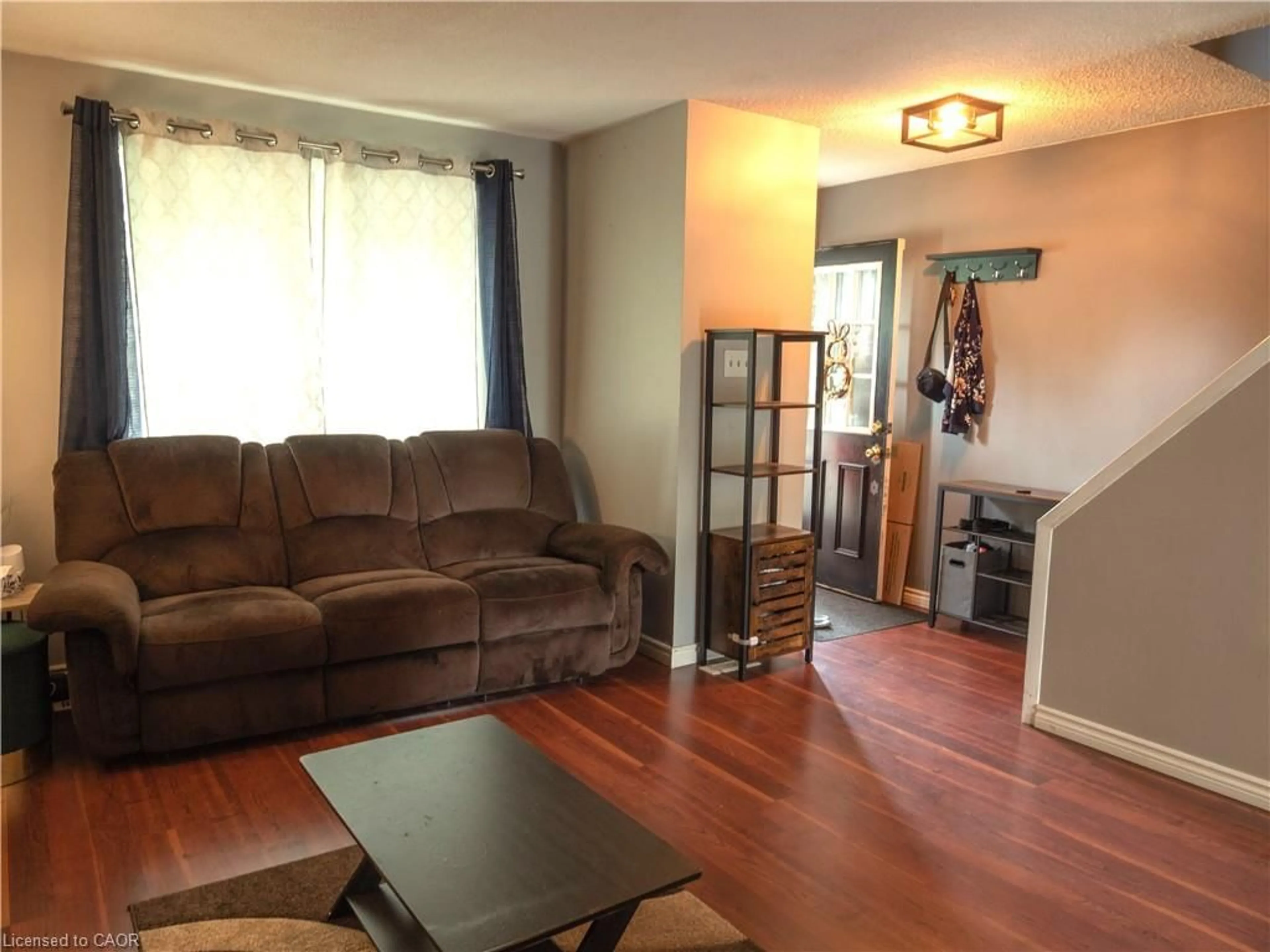 Living room with furniture, wood/laminate floor for 74 Lillian Dr #B, Waterloo Ontario N2J 4J9