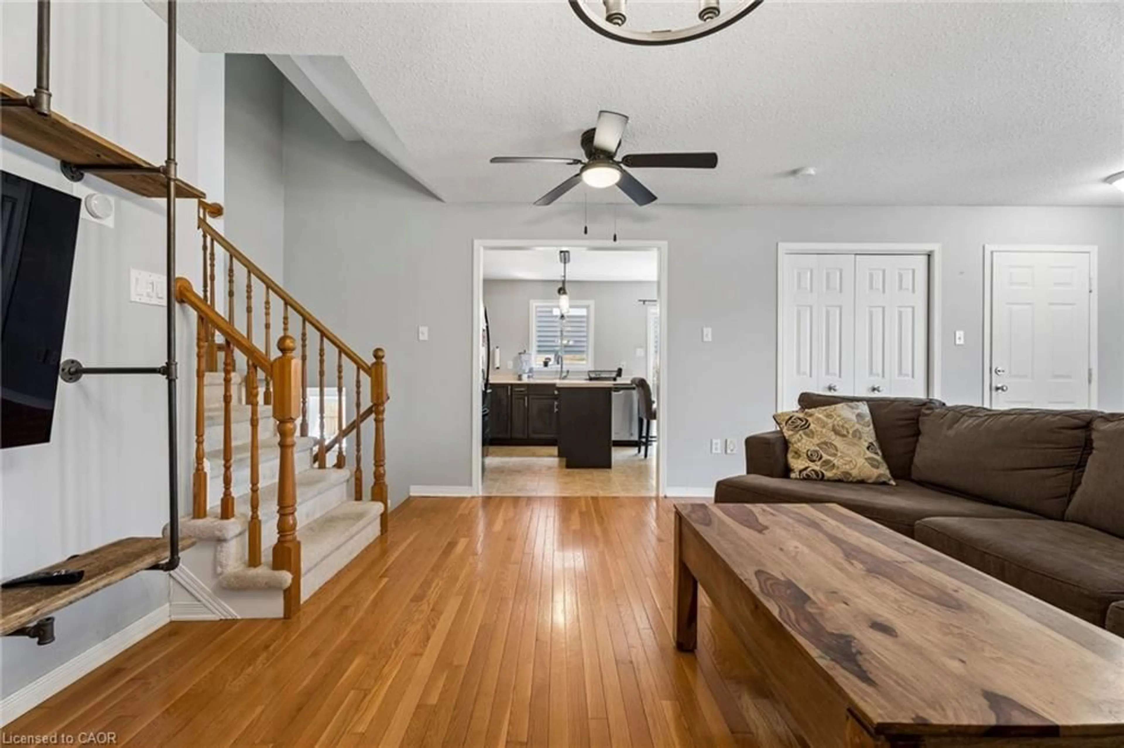 Living room with furniture, wood/laminate floor for 56 Golden Acres Dr, Smithville Ontario L0R 2A0