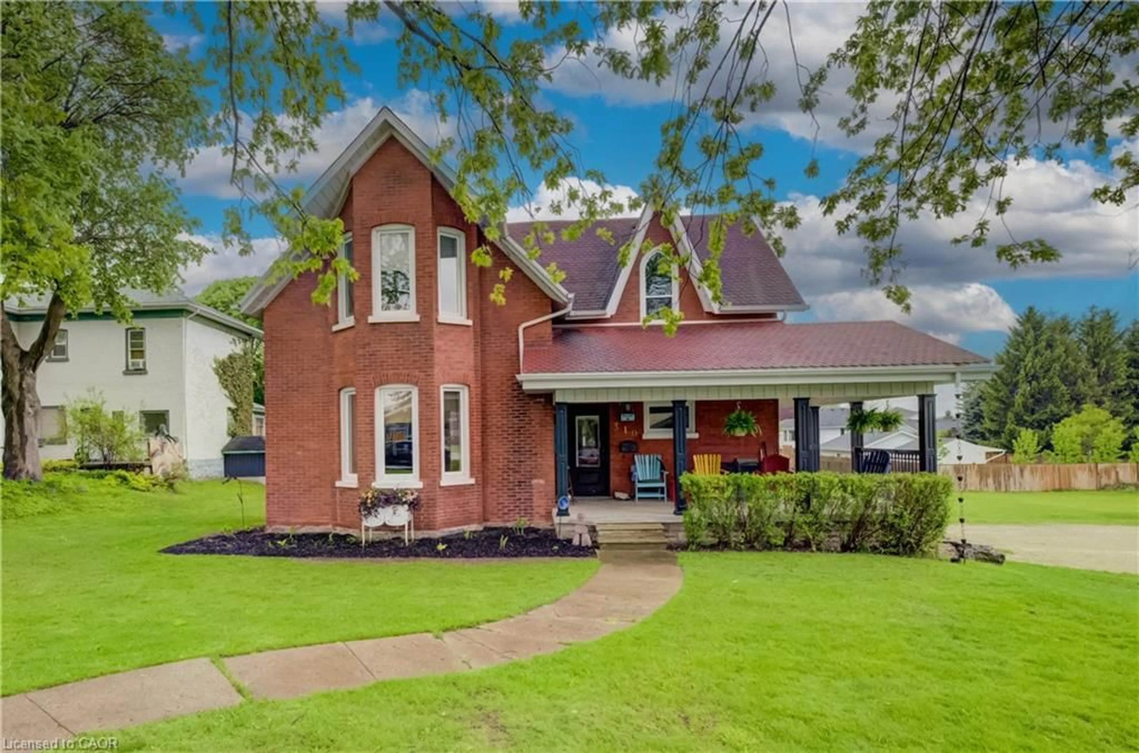 Home with brick exterior material, street for 310 Main St, Palmerston Ontario N0G 2P0