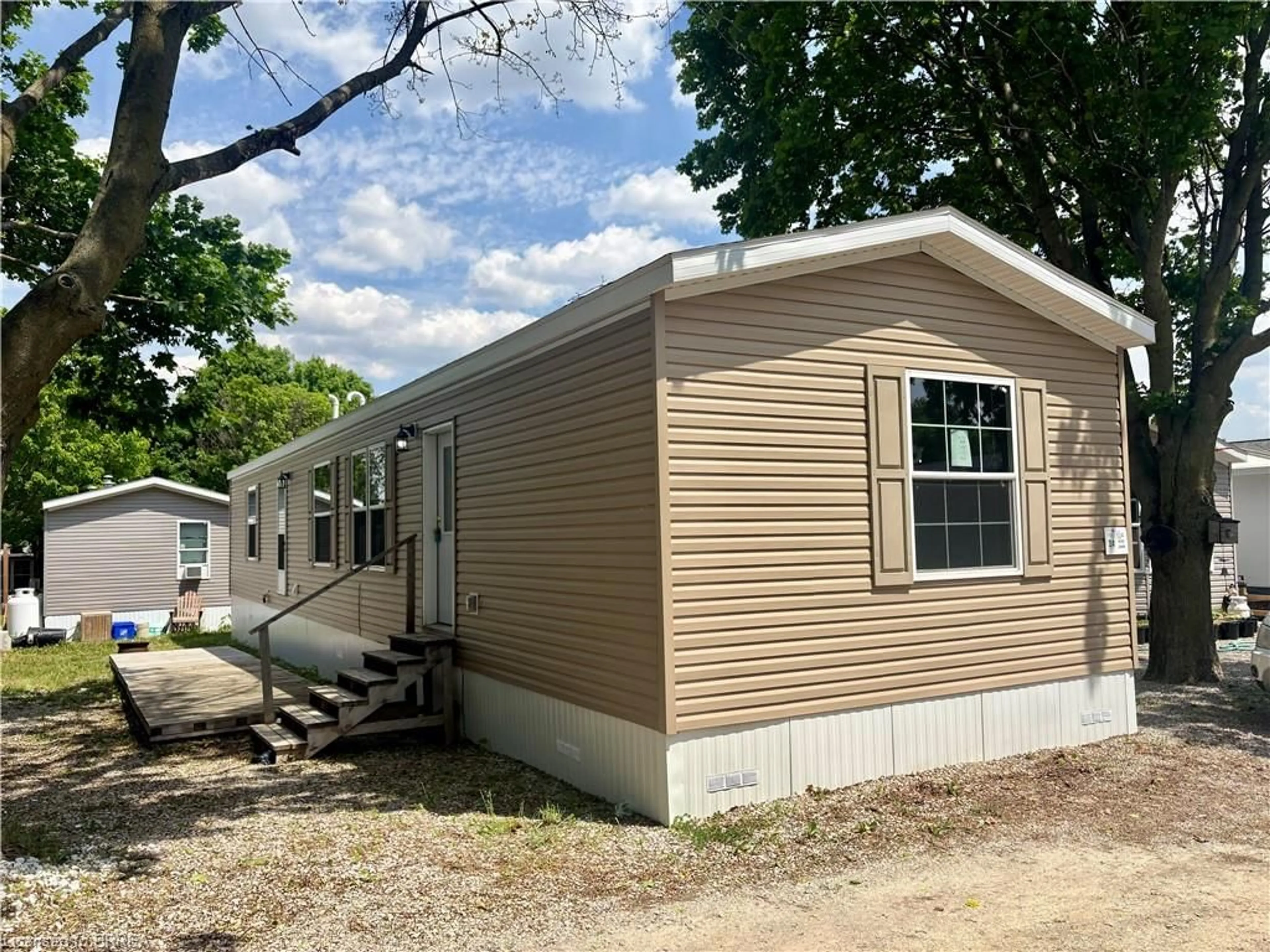 Home with vinyl exterior material, street for 99 Fourth Concession Rd #524, Burford Ontario N0E 1A0