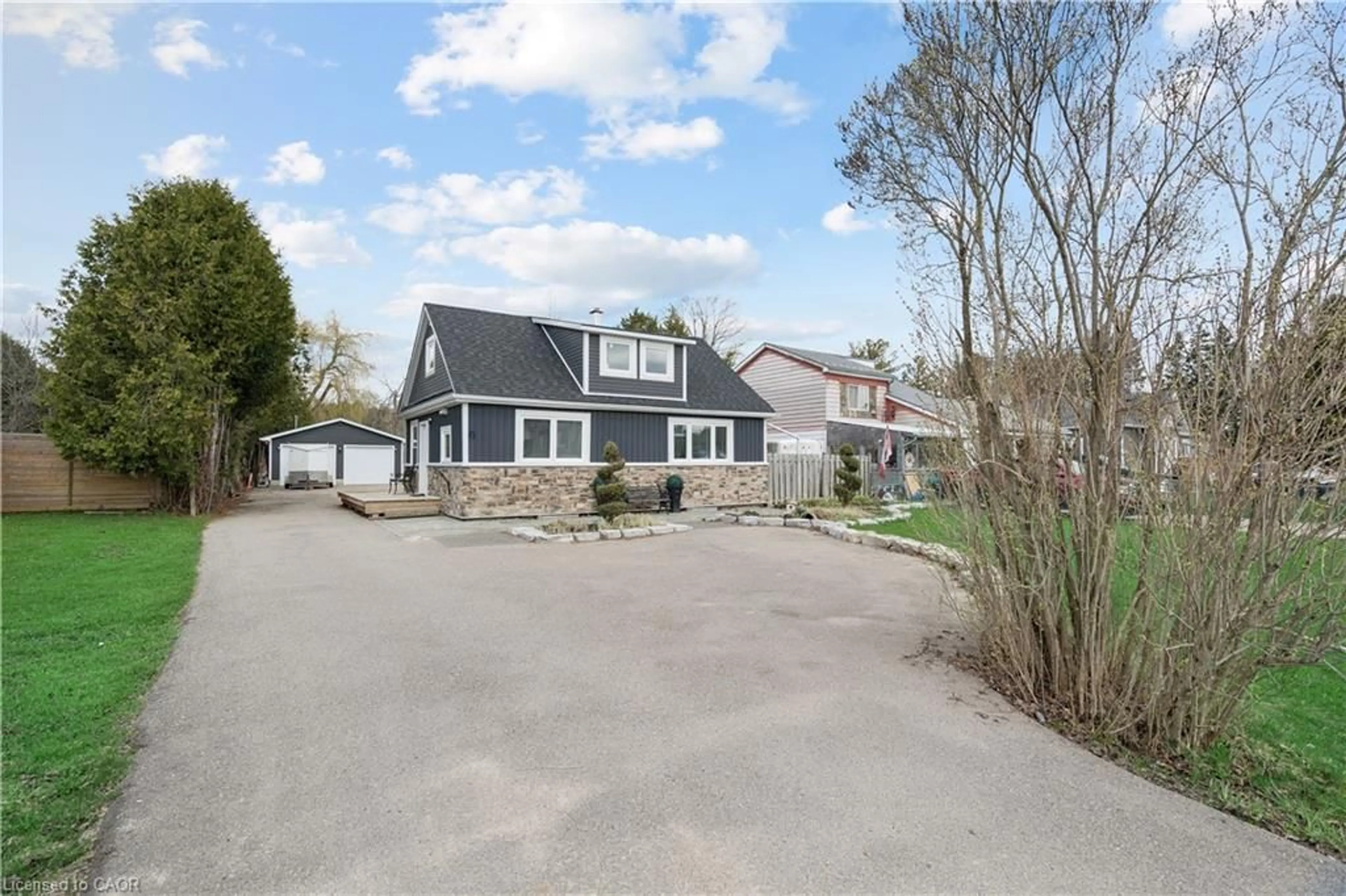 A pic from outside/outdoor area/front of a property/back of a property/a pic from drone, street for 9488 Wellington Rd 124, Erin Ontario N0B 1T0