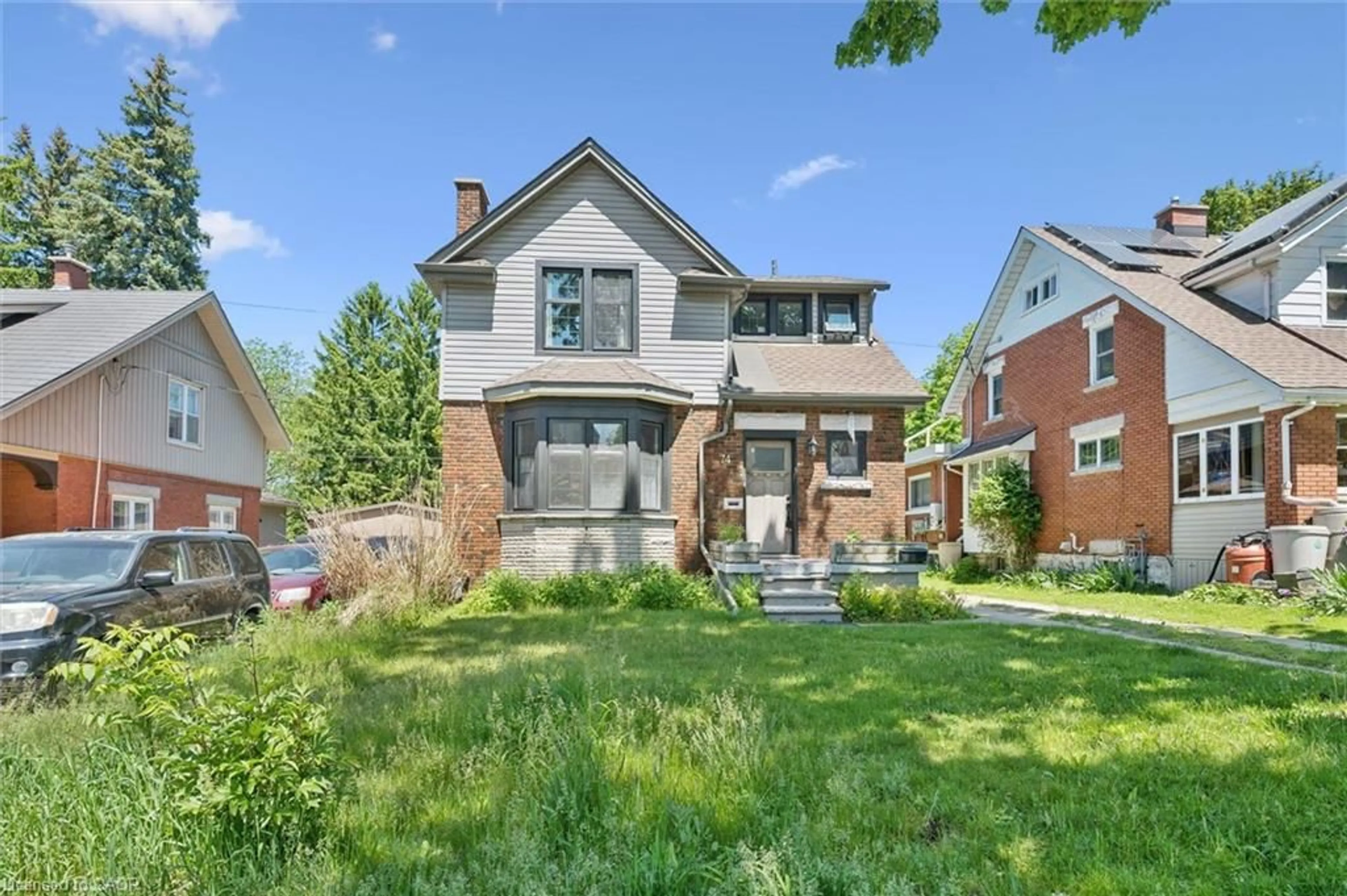 Home with brick exterior material, street for 74 Homewood Ave, Kitchener Ontario N2M 1W9