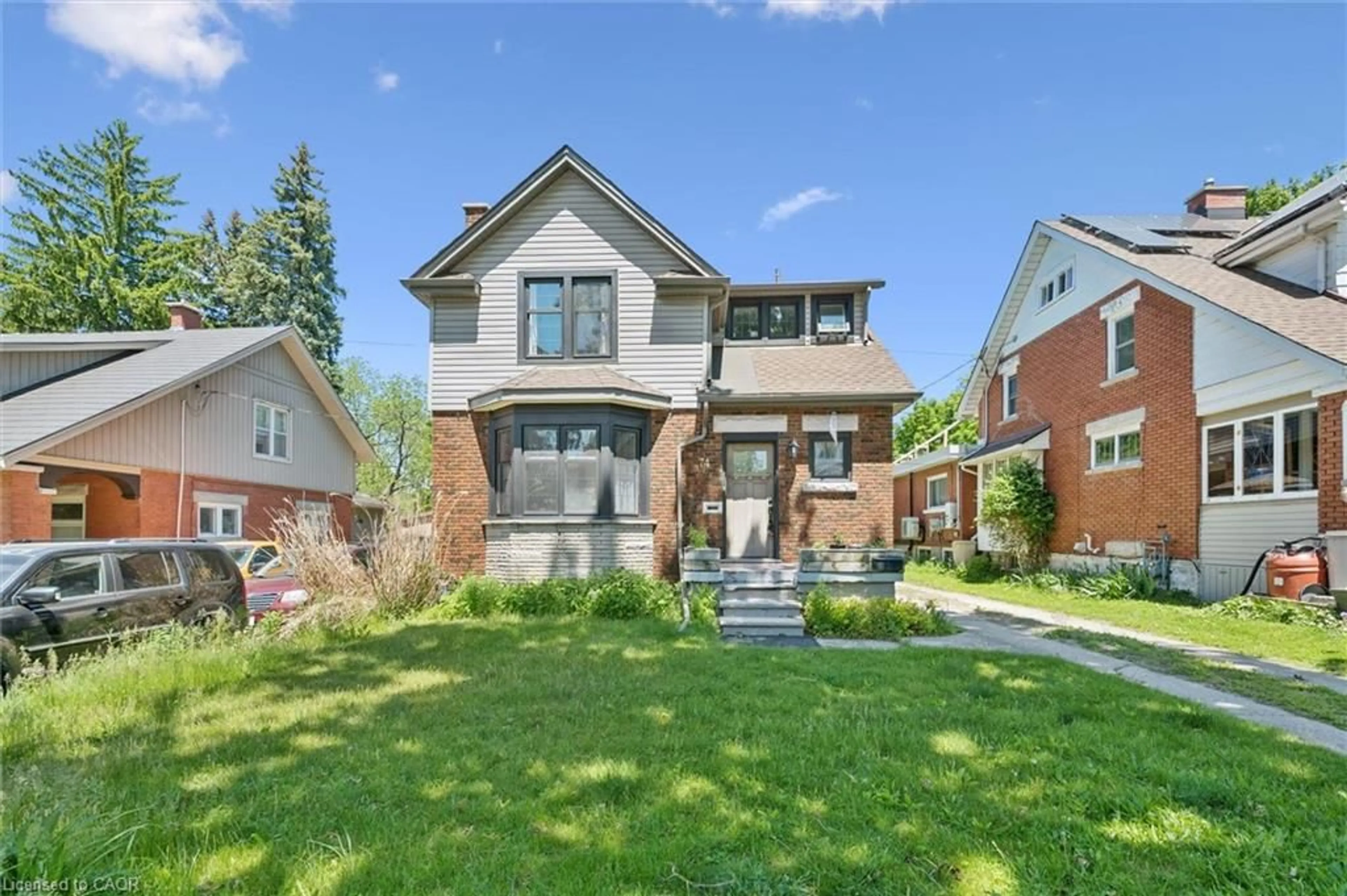 Home with brick exterior material, street for 74 Homewood Ave, Kitchener Ontario N2M 1W9