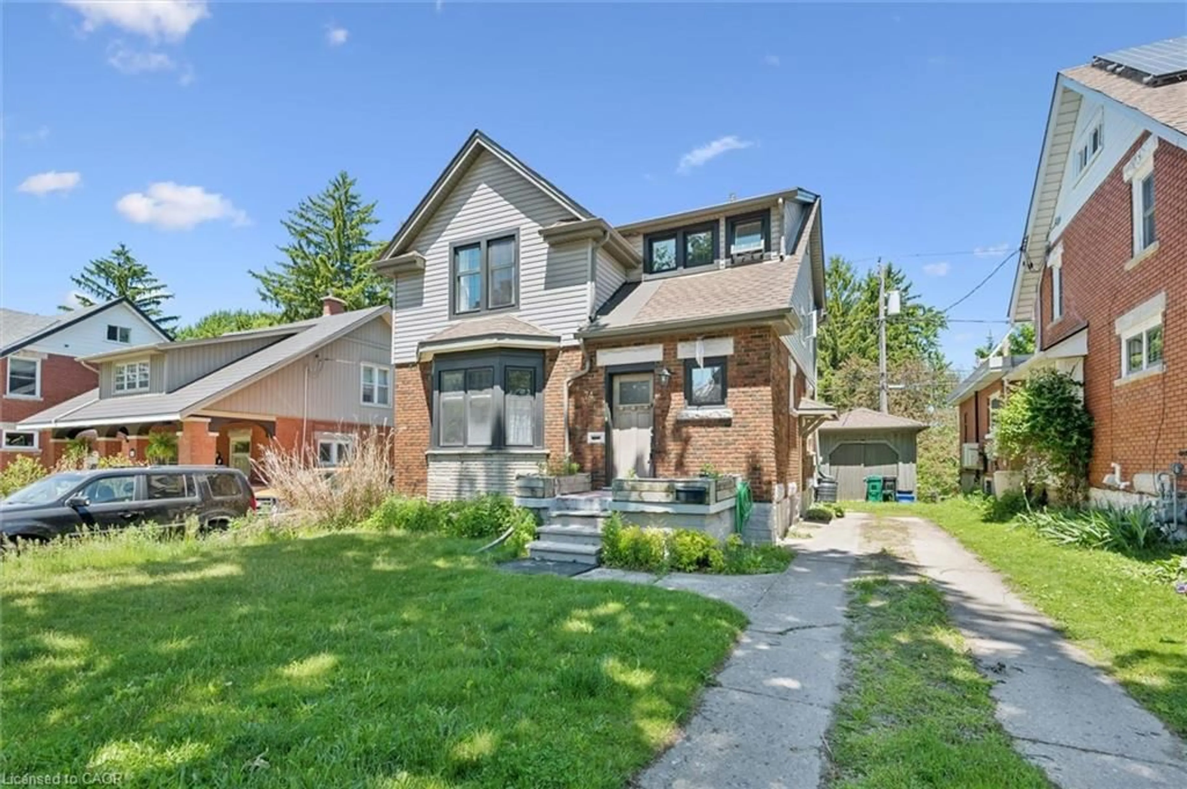 Home with brick exterior material, street for 74 Homewood Ave, Kitchener Ontario N2M 1W9