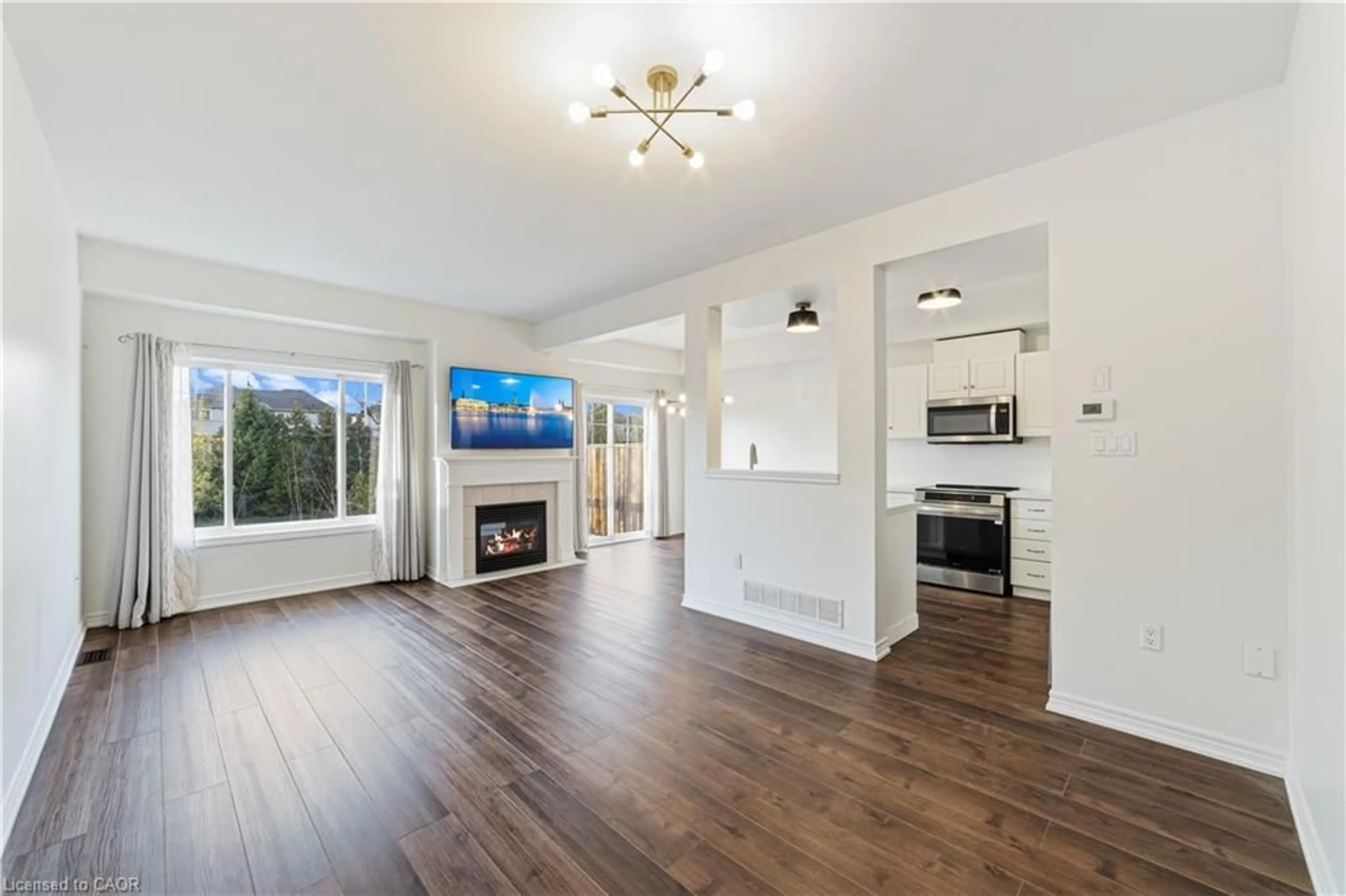 Open concept kitchen, wood/laminate floor for 9 Liddycoat Lane #18, Ancaster Ontario L9G 0A7