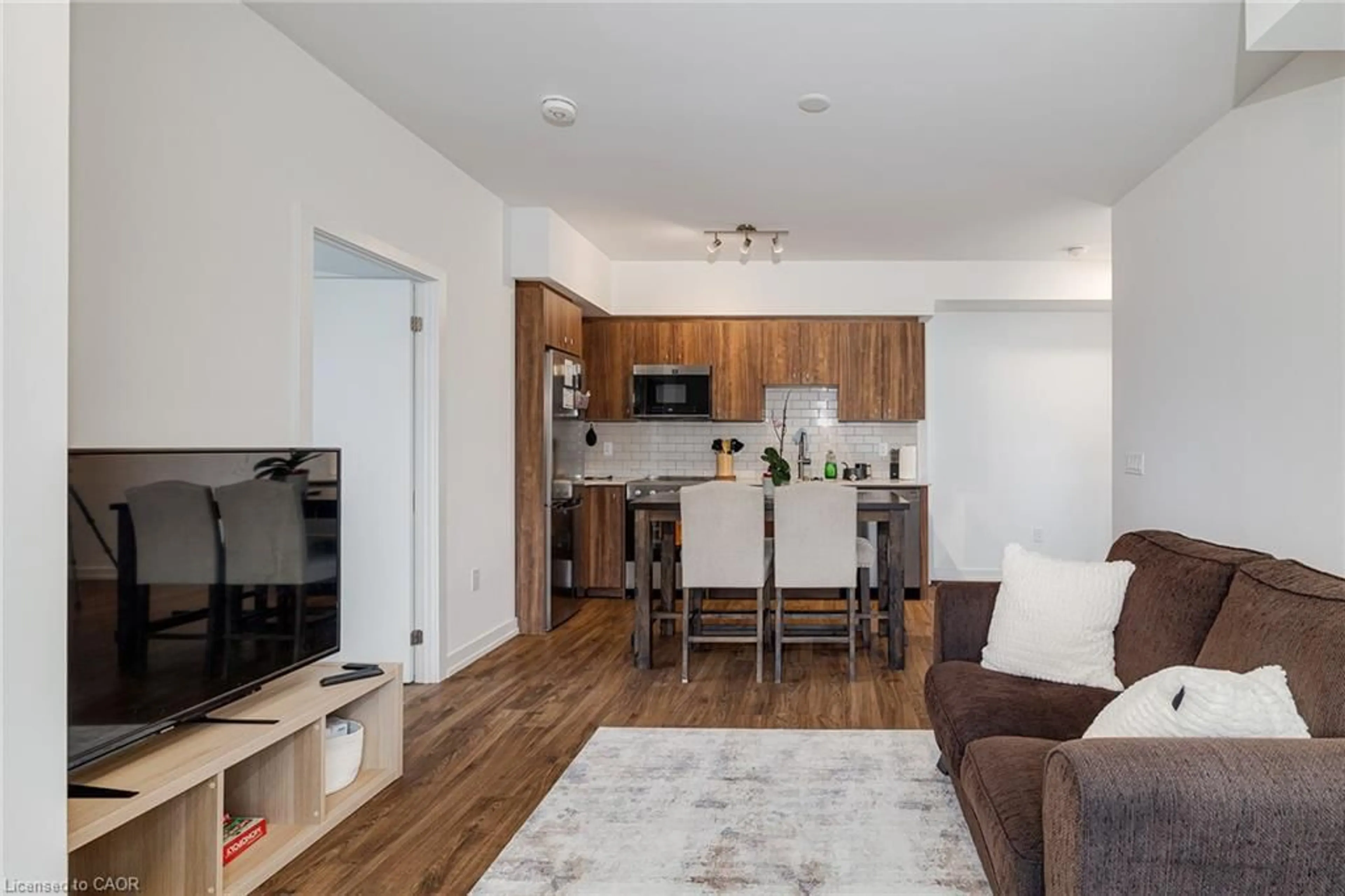 Living room with furniture, wood/laminate floor for 15 Wellington St #1909, Kitchener Ontario N2G 0E4