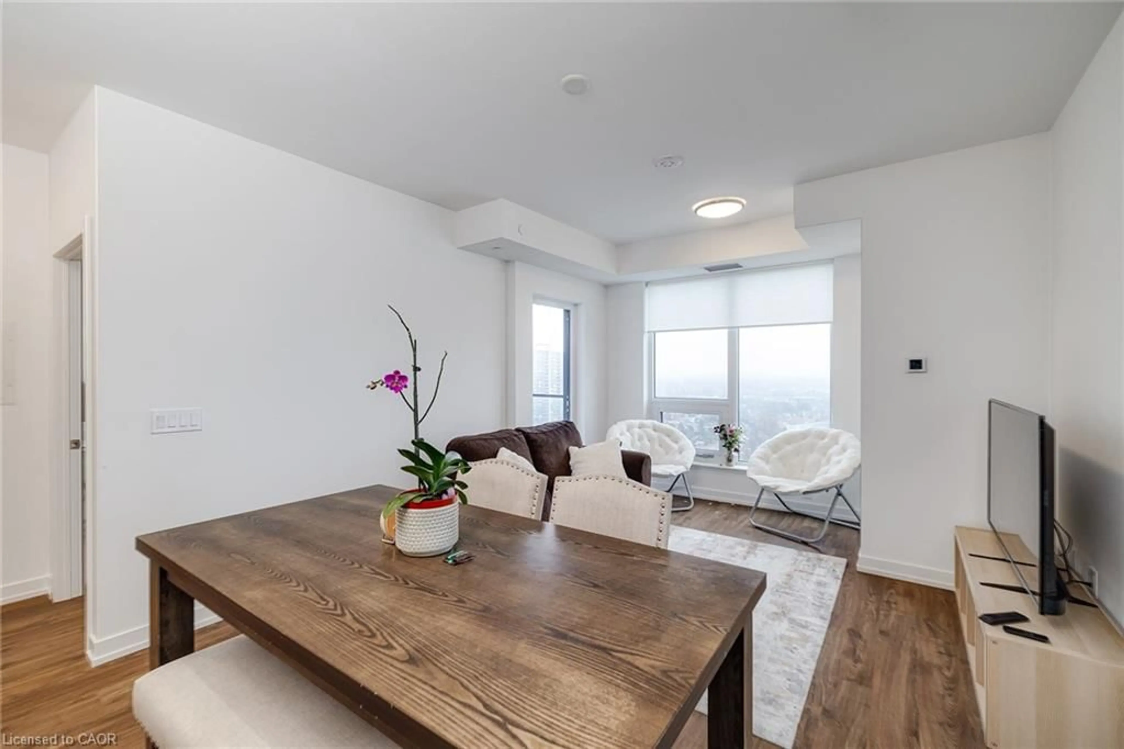 Living room with furniture, wood/laminate floor for 15 Wellington St #1909, Kitchener Ontario N2G 0E4