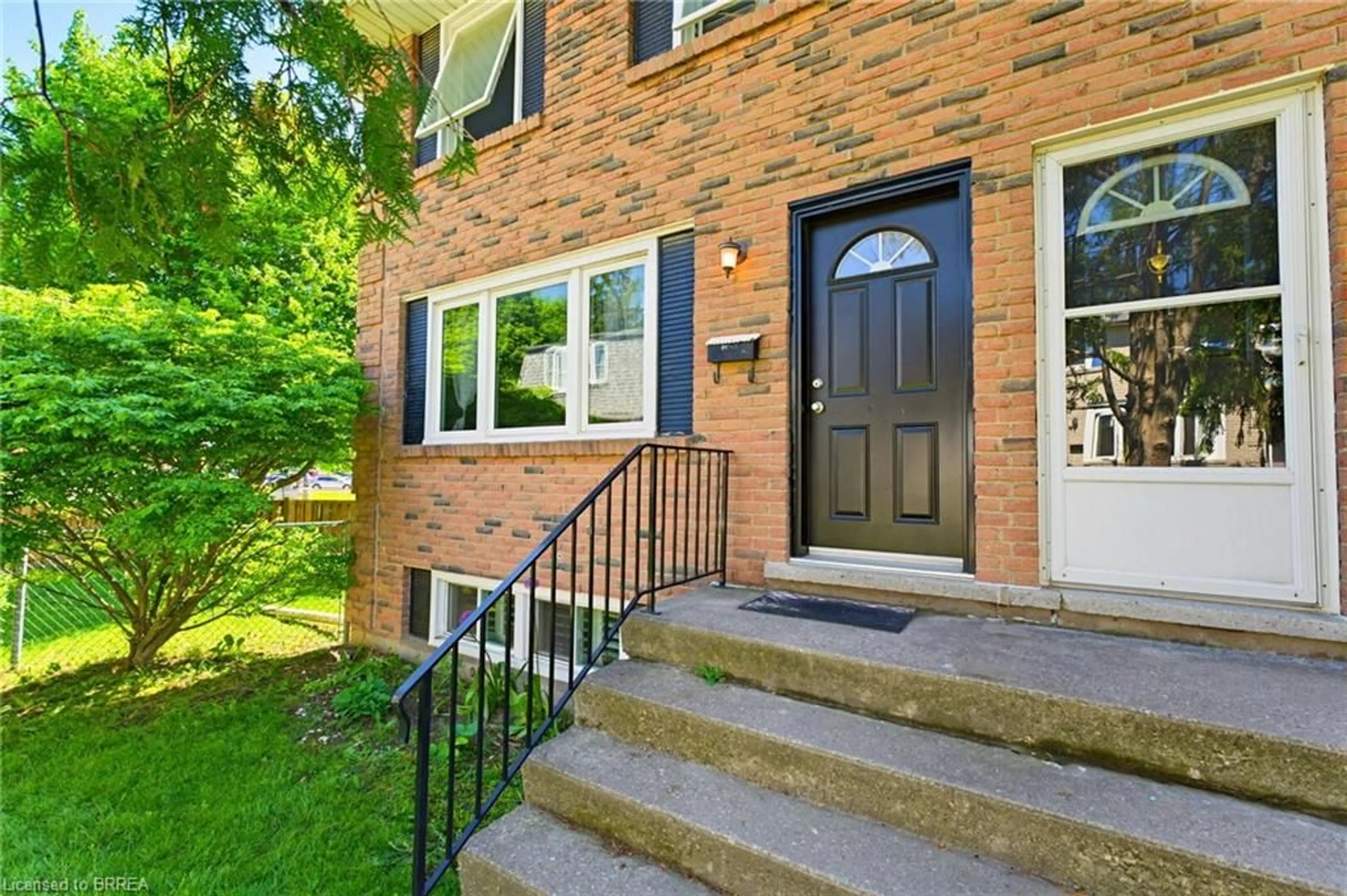 Home with brick exterior material, street for 26 Coachwood Rd #6, Brantford Ontario N3R 3R4