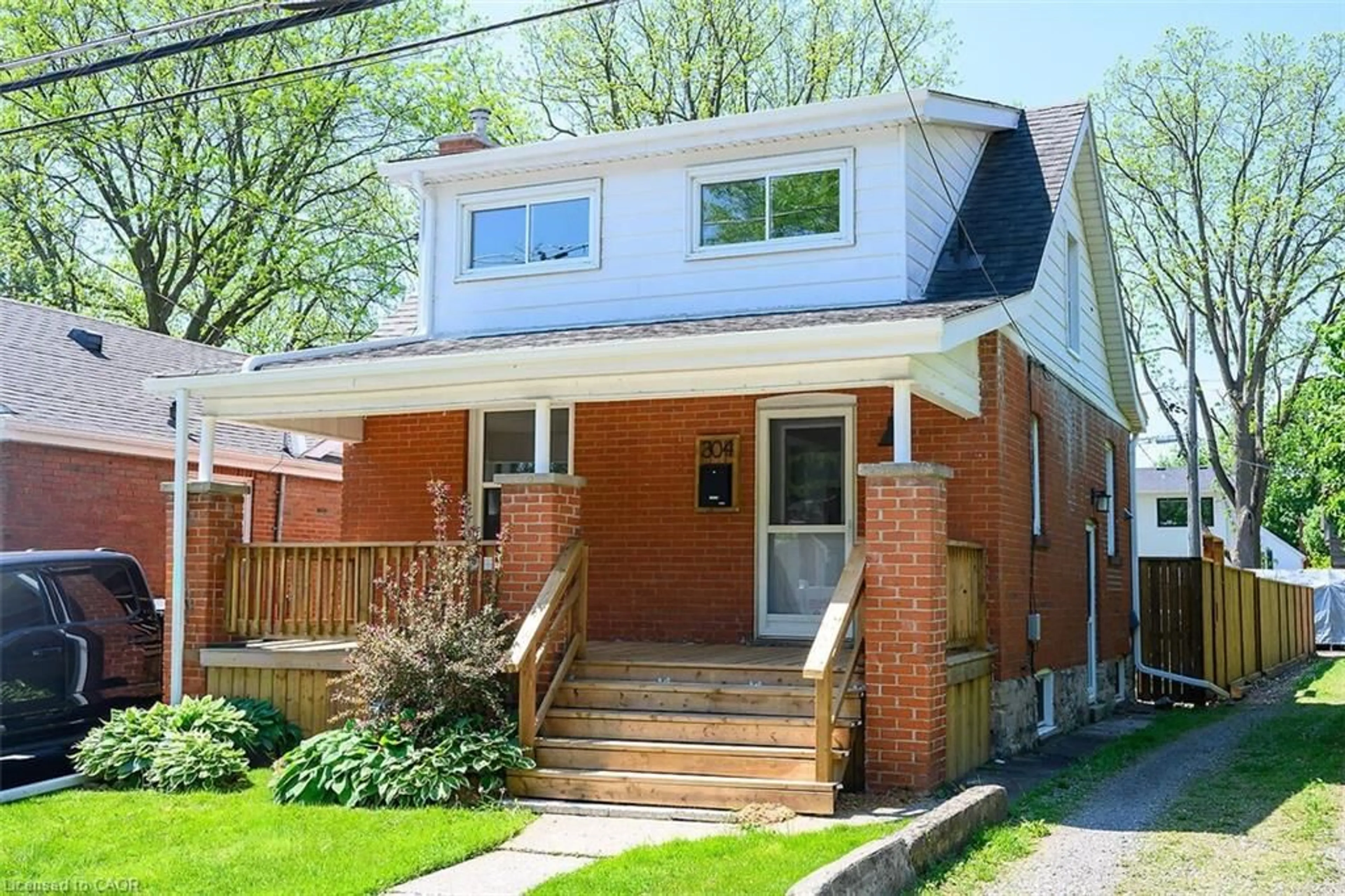 Home with brick exterior material, street for 304 Park St, Hamilton Ontario L9H 1Y9