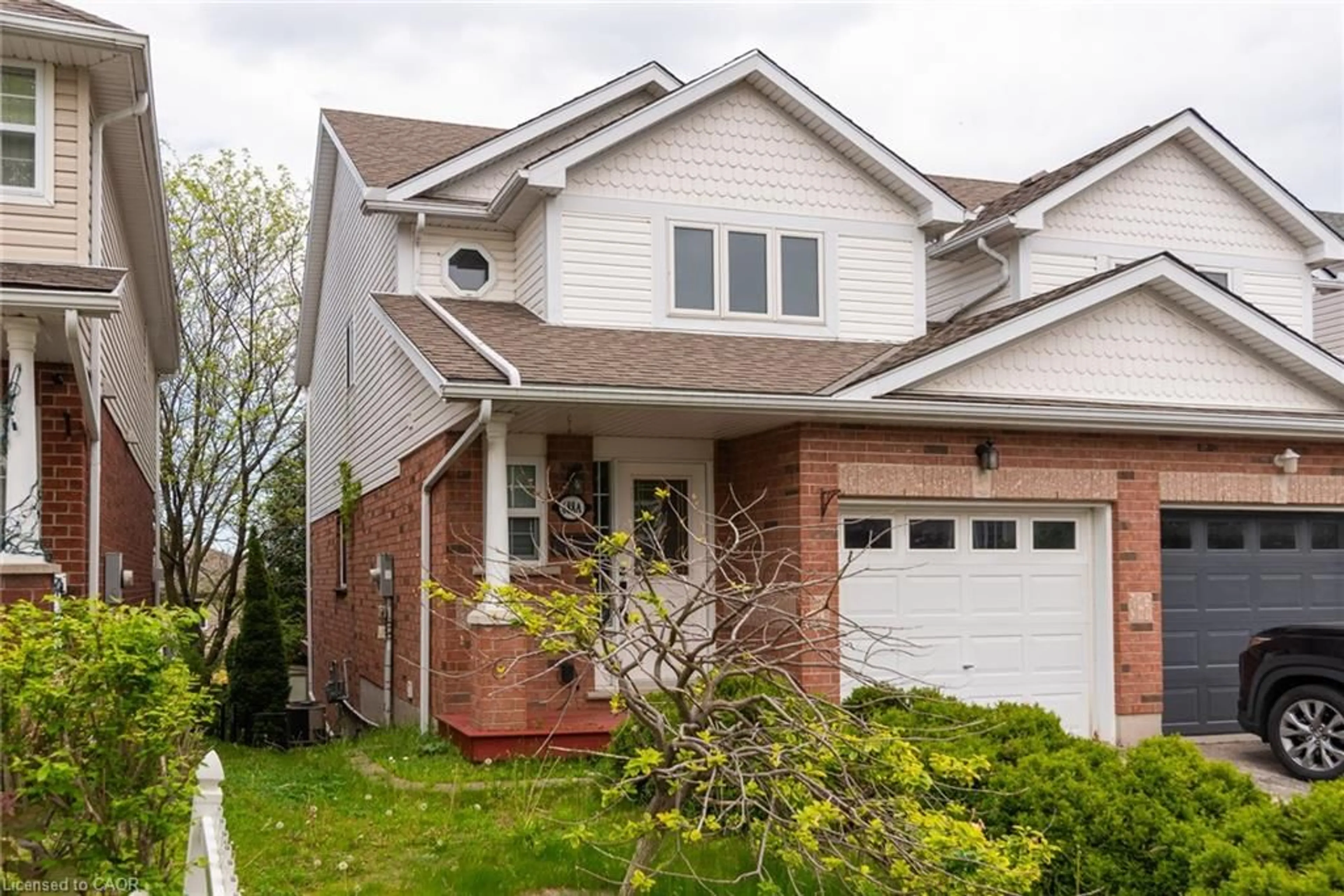 Home with brick exterior material, street for 688 Star Flower Ave #A, Waterloo Ontario N2V 2L2