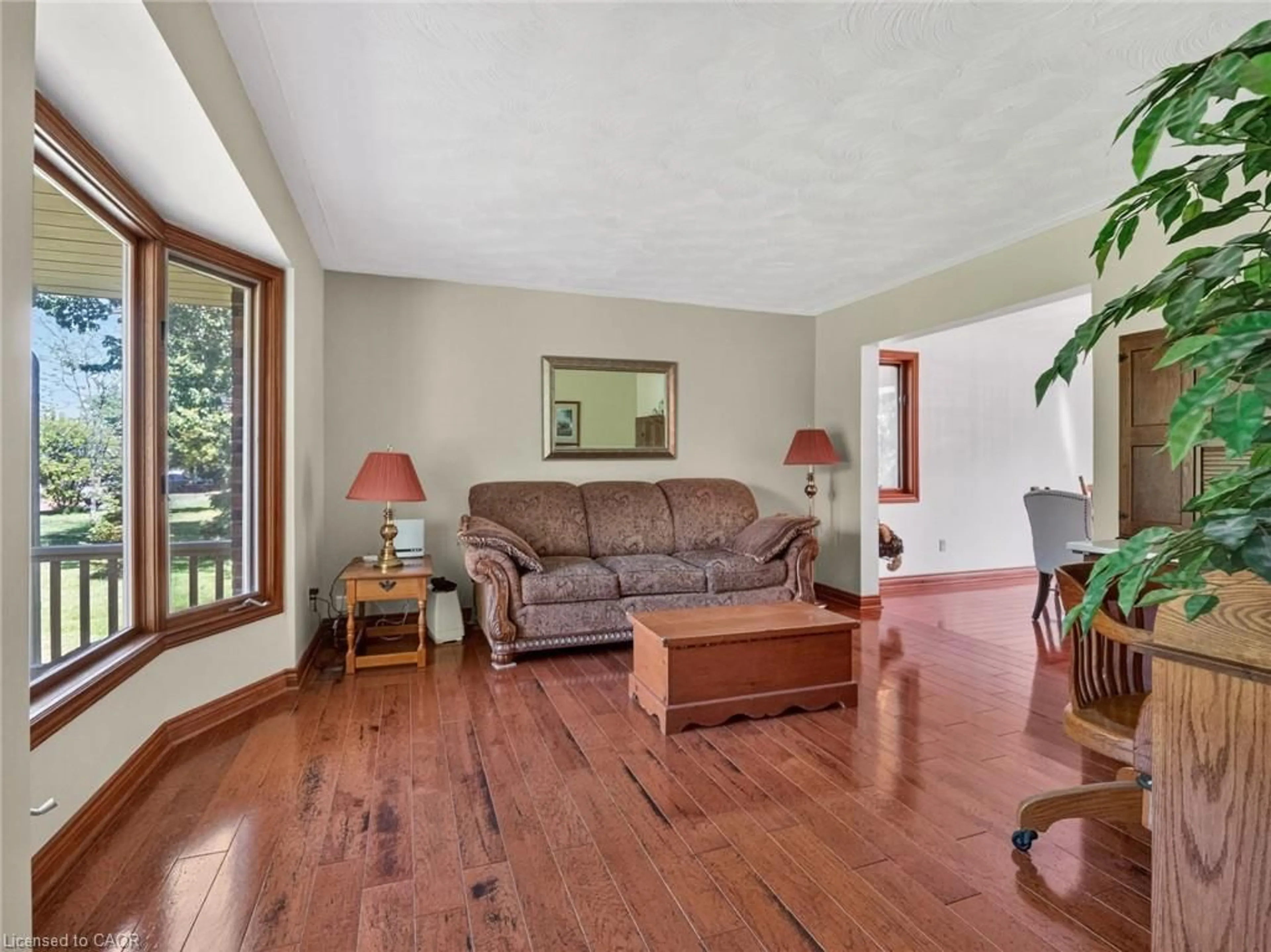 Living room with furniture, wood/laminate floor for 42965 Highway 3, Wainfleet Ontario L0S 1V0
