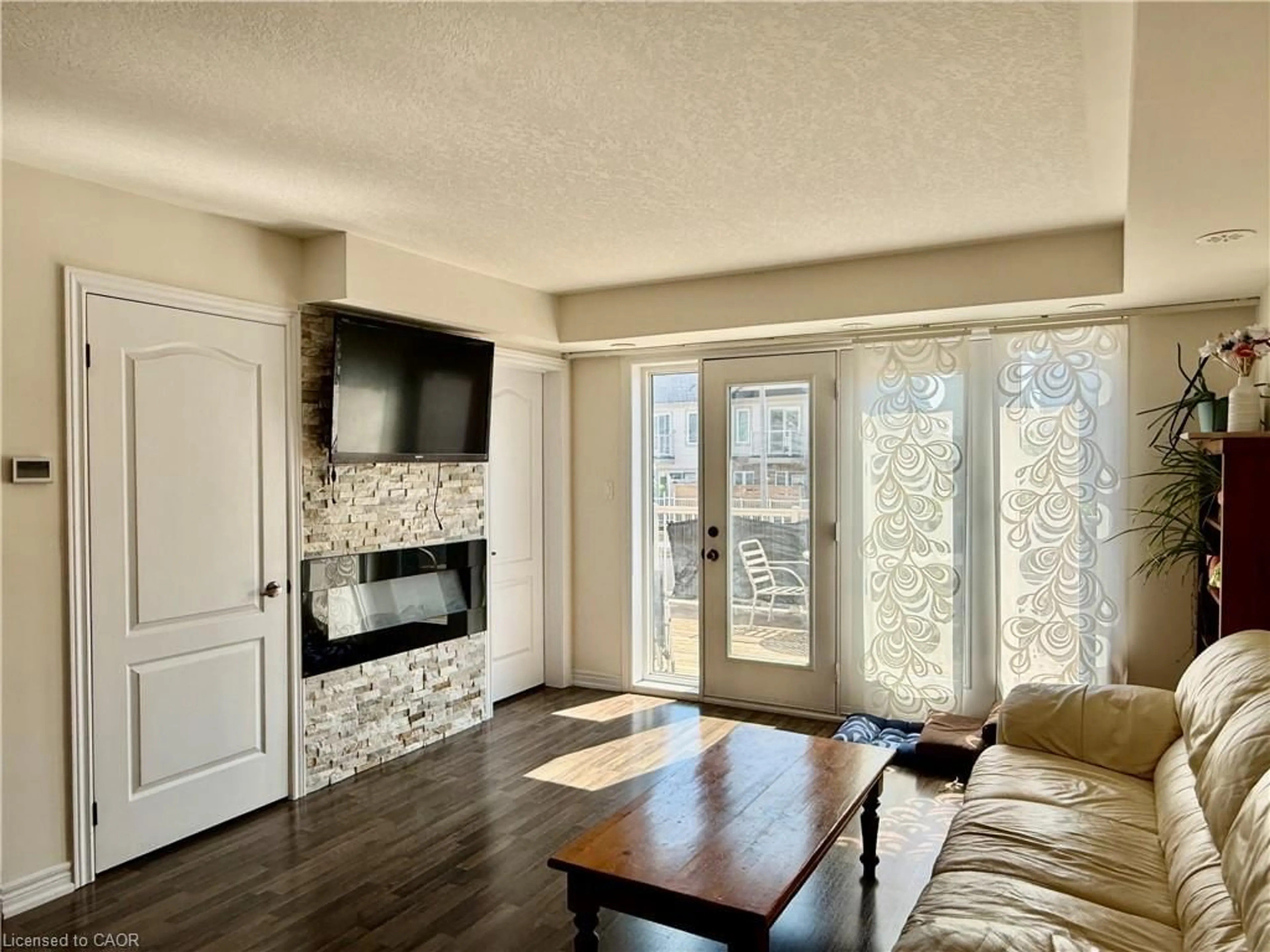 Living room with furniture, wood/laminate floor for 146 Watson Pky, Guelph Ontario N1E 0P6