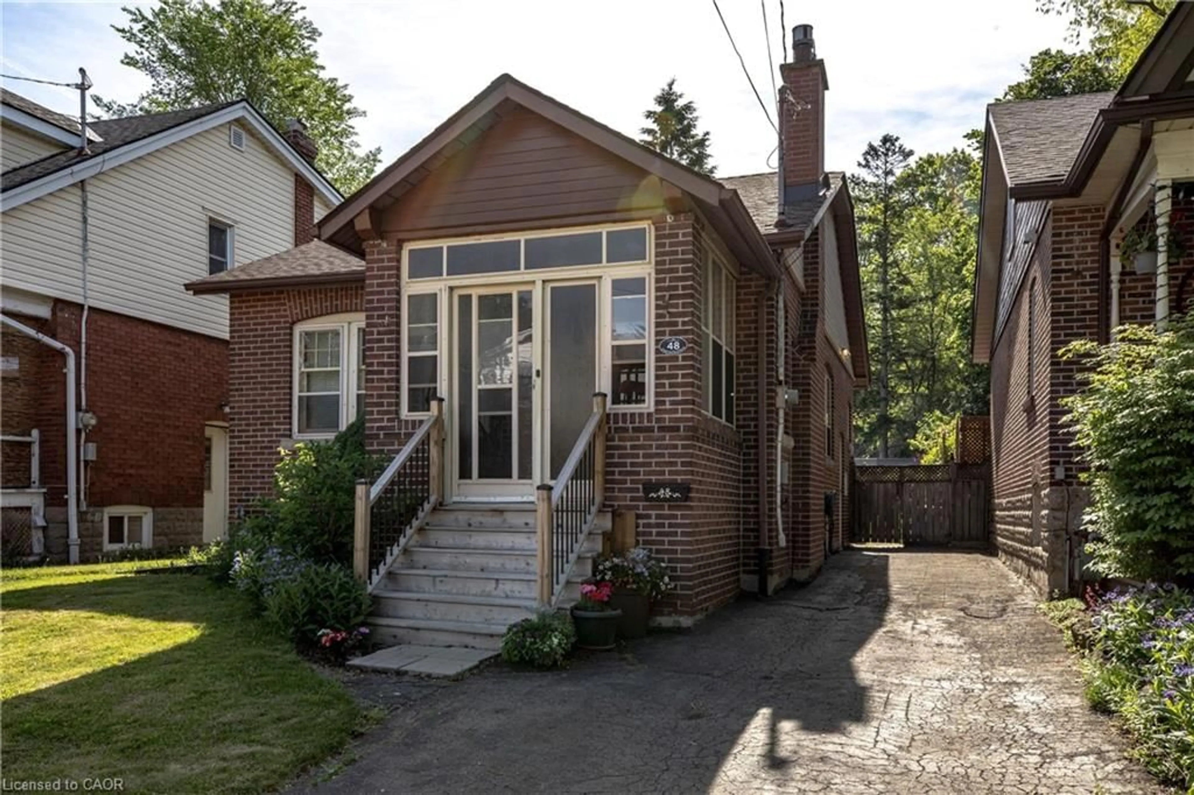 Home with brick exterior material, street for 48 Longwood Rd, Hamilton Ontario L8S 3V4