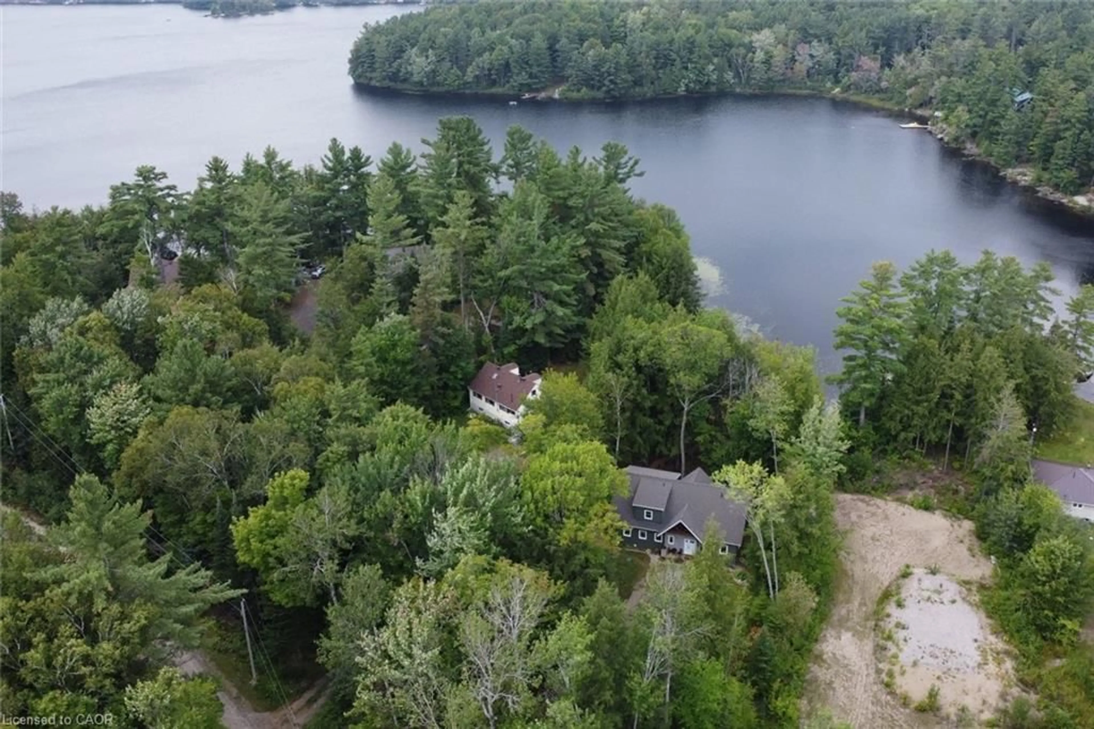 A pic from outside/outdoor area/front of a property/back of a property/a pic from drone, water/lake/river/ocean view for 1417 Dickie Lake Rd, Baysville Ontario P0B 1A0