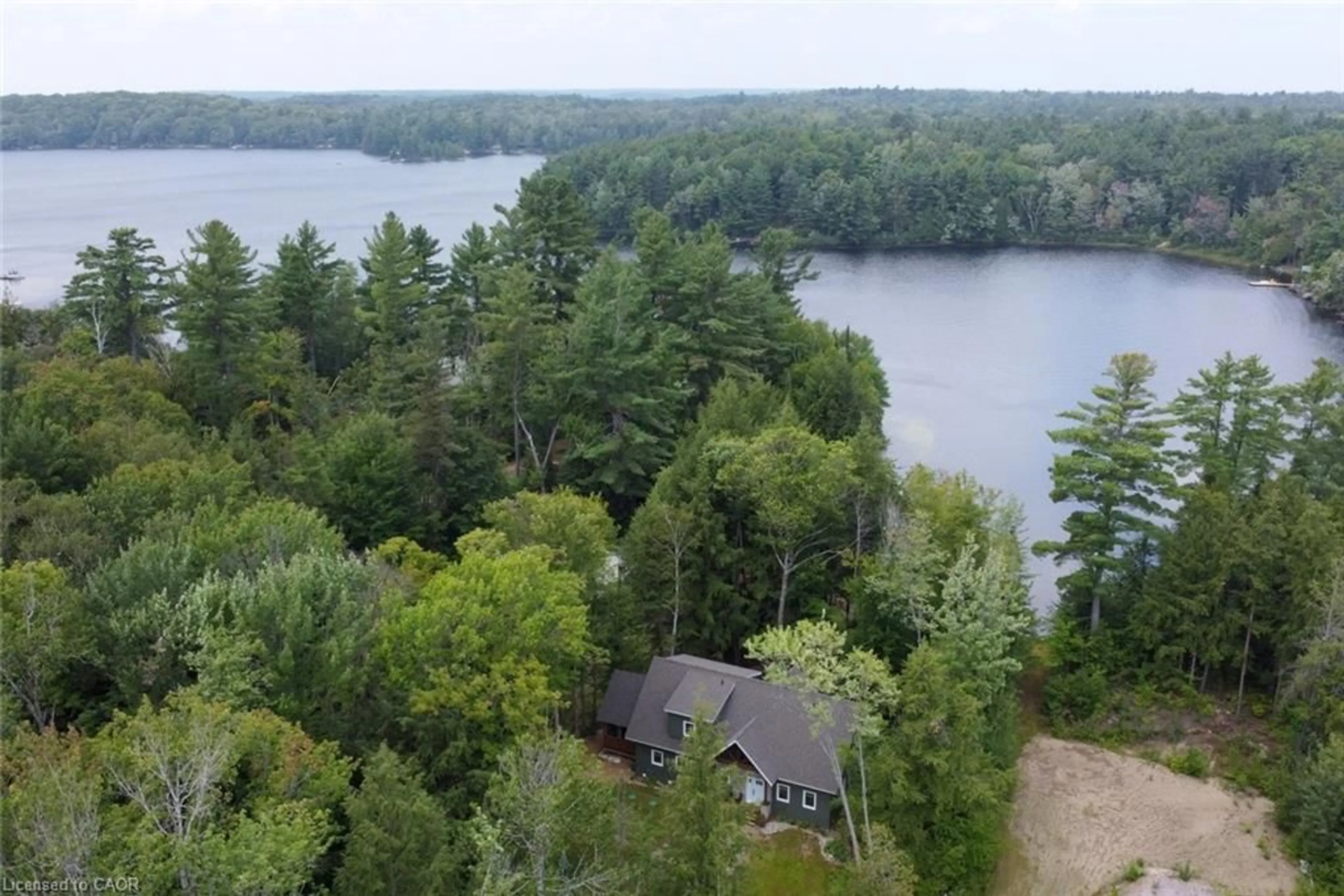 A pic from outside/outdoor area/front of a property/back of a property/a pic from drone, water/lake/river/ocean view for 1417 Dickie Lake Rd, Baysville Ontario P0B 1A0