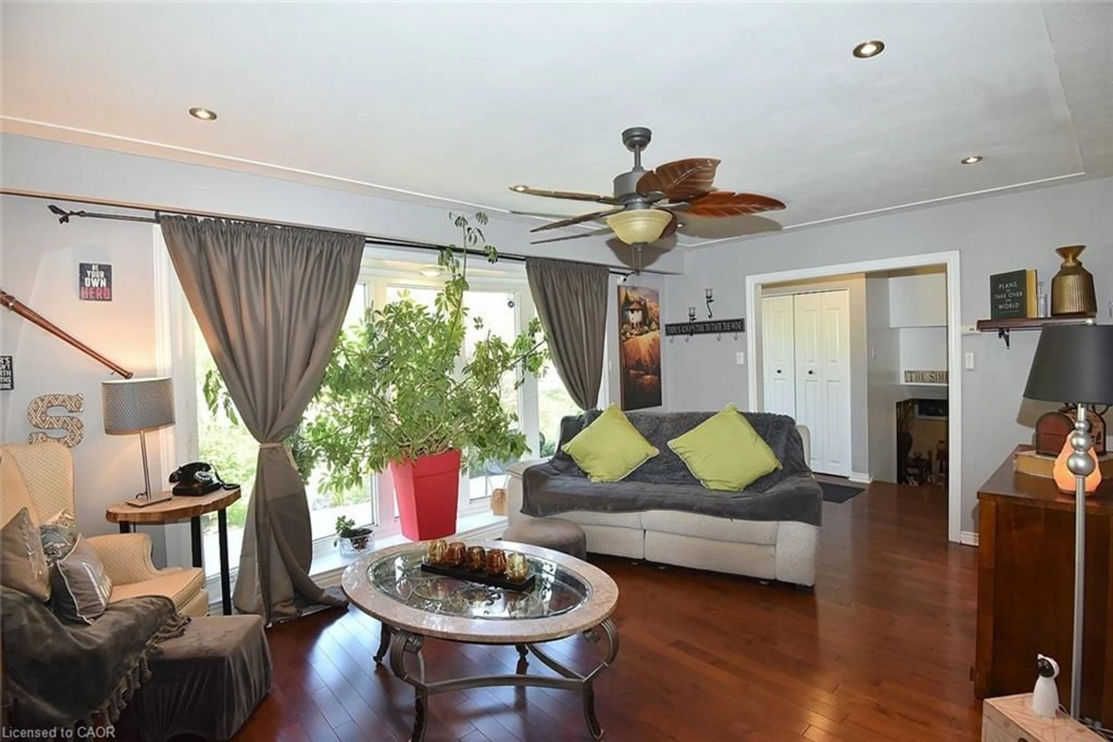Living room with furniture, wood/laminate floor for 18 Dennis Ave, Waterdown Ontario L9H 7G2