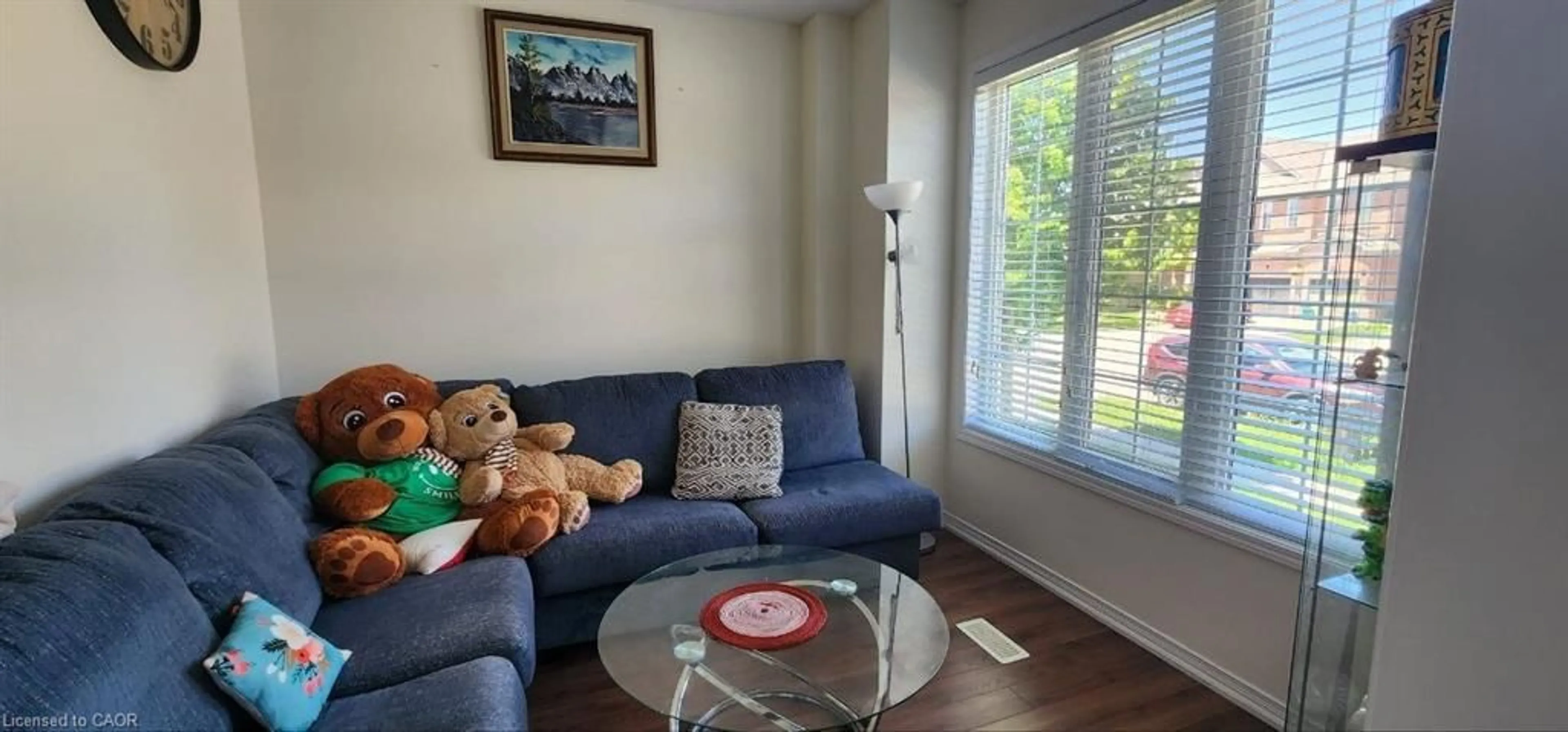 Living room with furniture, wood/laminate floor for 16 Gillespie Dr, Brantford Ontario N3T 0J7