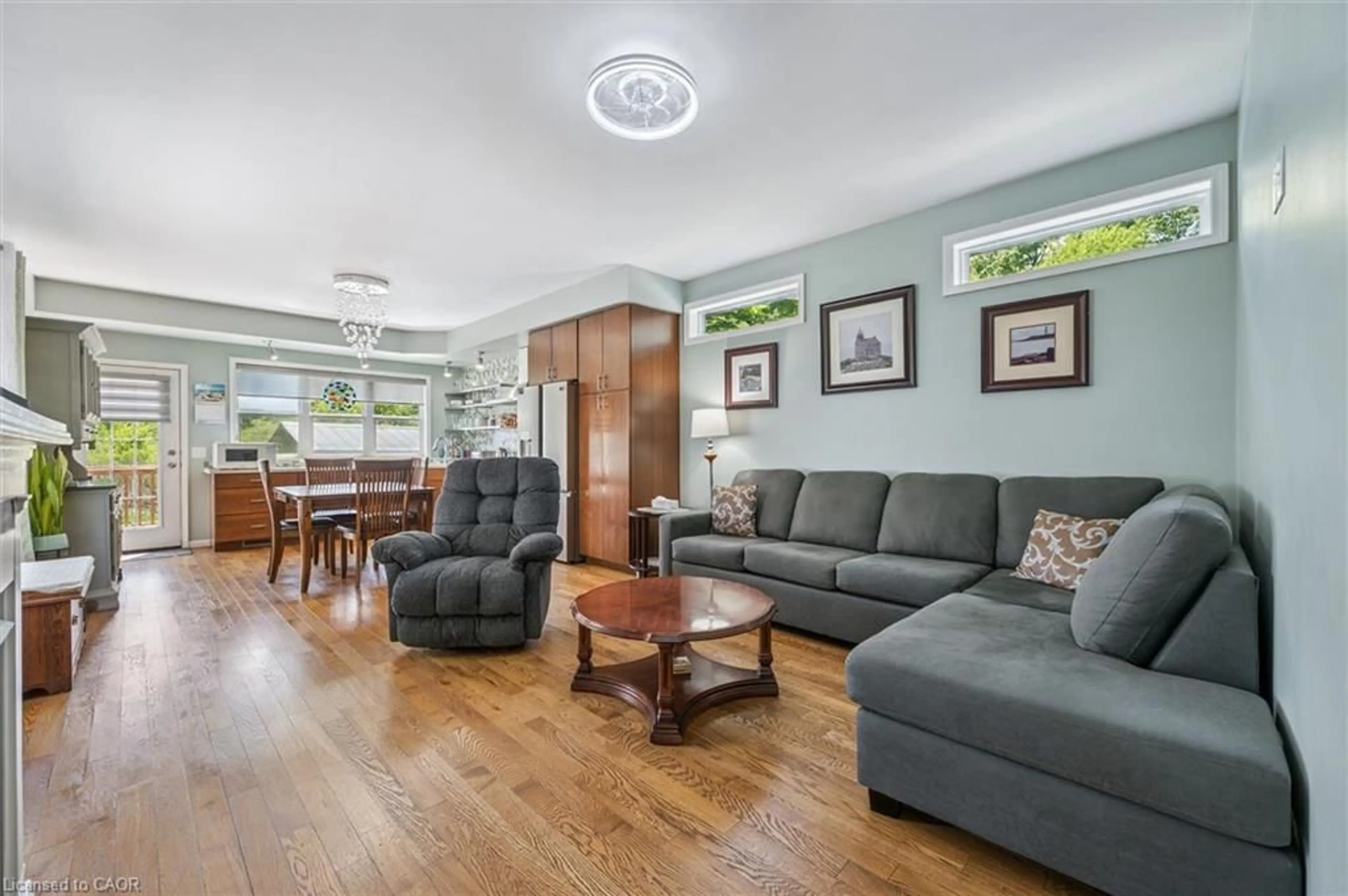 Living room with furniture, wood/laminate floor for 56 Ash Ave Ave, Puslinch Ontario N0B 2J0